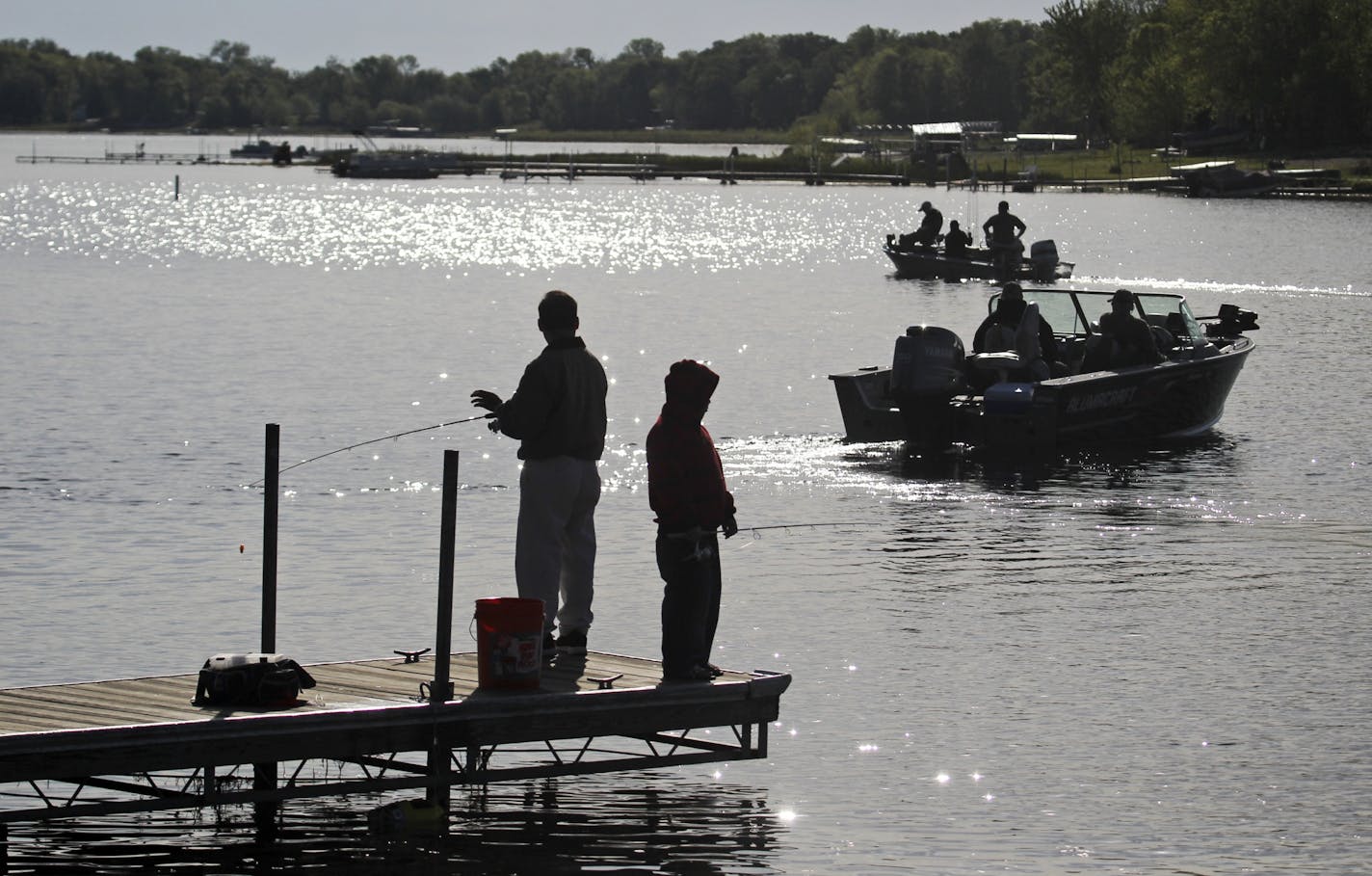 Fisherman on docks and in boats shared the waters of South Lindstrom Lake near the public boat lanuch during the fishing opener in Lindstrom, MN, Saturday, May 12, 2012.