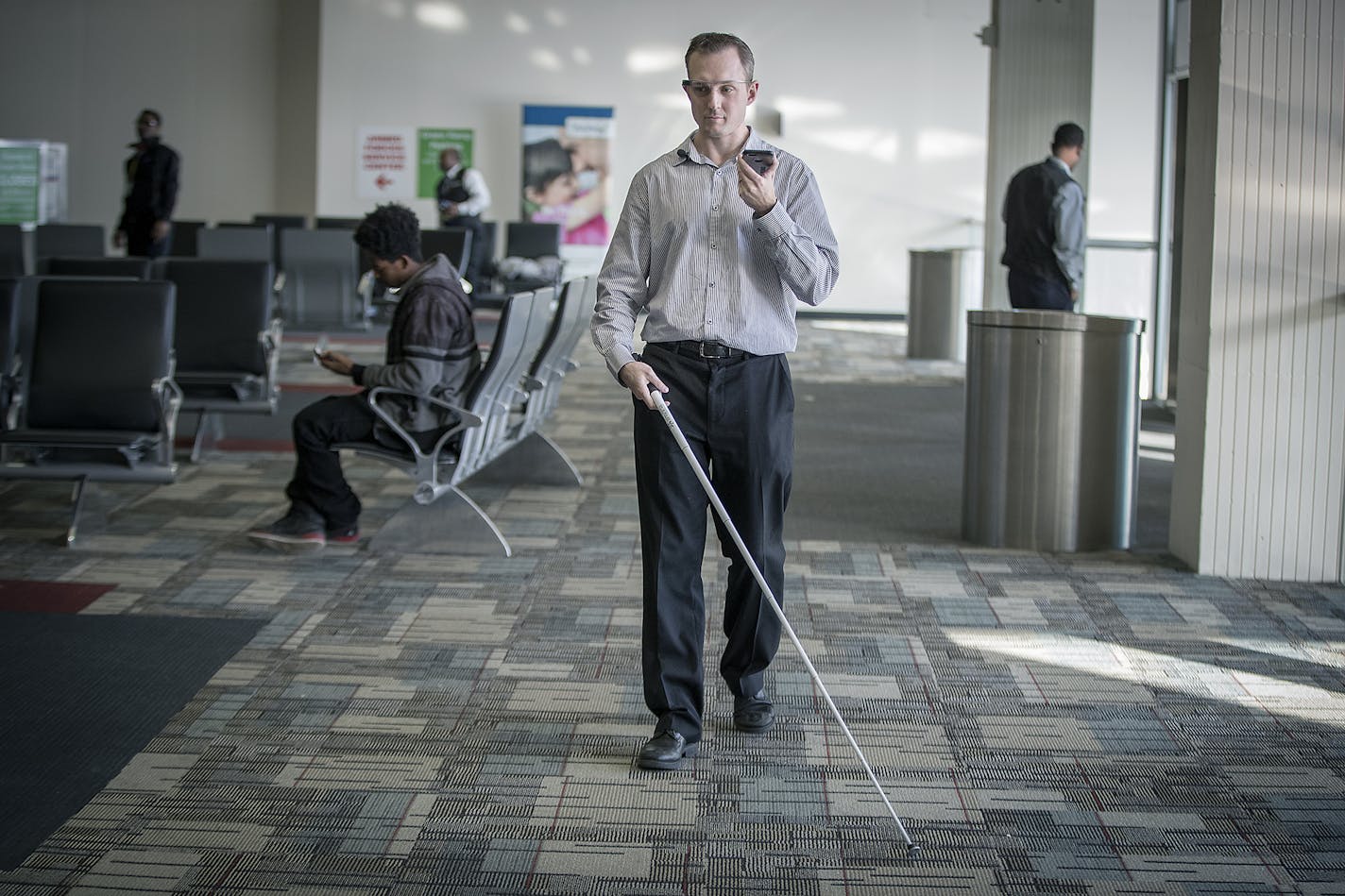 Greg Stilson, who is visually impaired, used a visual interpreting device to get around at the MSP Airport, Wednesday, January 3, 2018 in Bloomington, MN. MSP will offer the service free starting Wednesday as part of its goal of being one of the most accessible airports in the nation. ] ELIZABETH FLORES &#xef; liz.flores@startribune.com