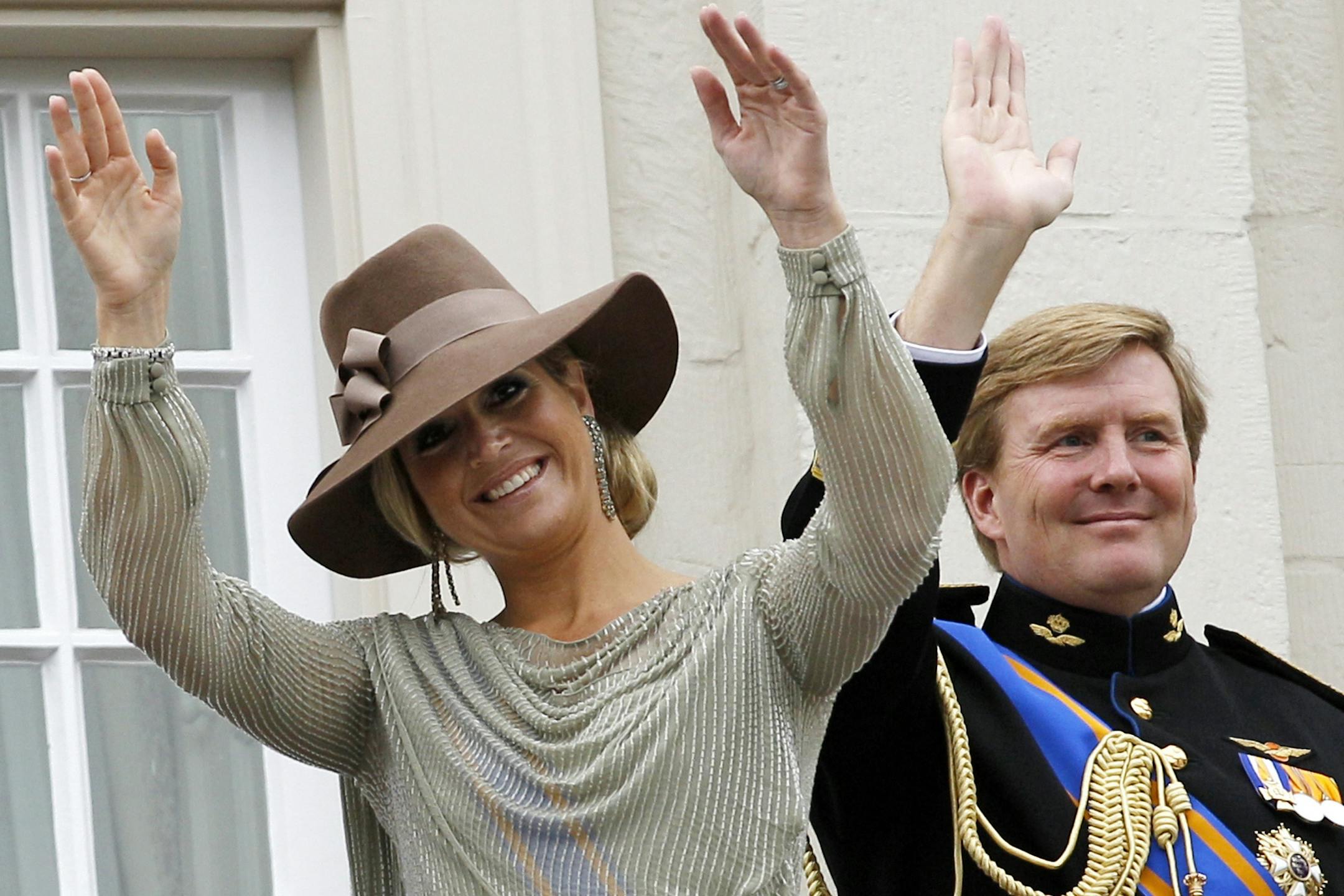 FILE -- Dutch Crown Prince Willem Alexander, right, and his wife Princess Maxima wave to wellwishers from the balcony of Royal Palace Noordeinde in Sept. 2011.