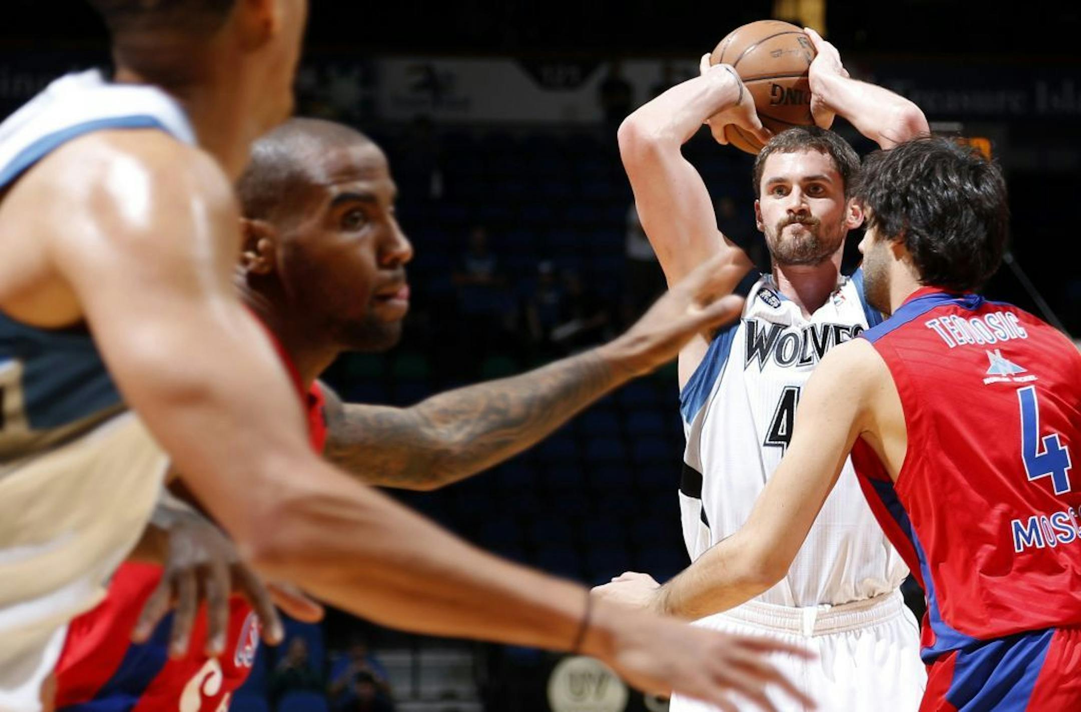 Minnesota Timberwolves' Kevin Love looks to pass the ball during the first quarter against CSKA Moscow during their exhibition game in Minneapolis on Monday, October 7, 2013.