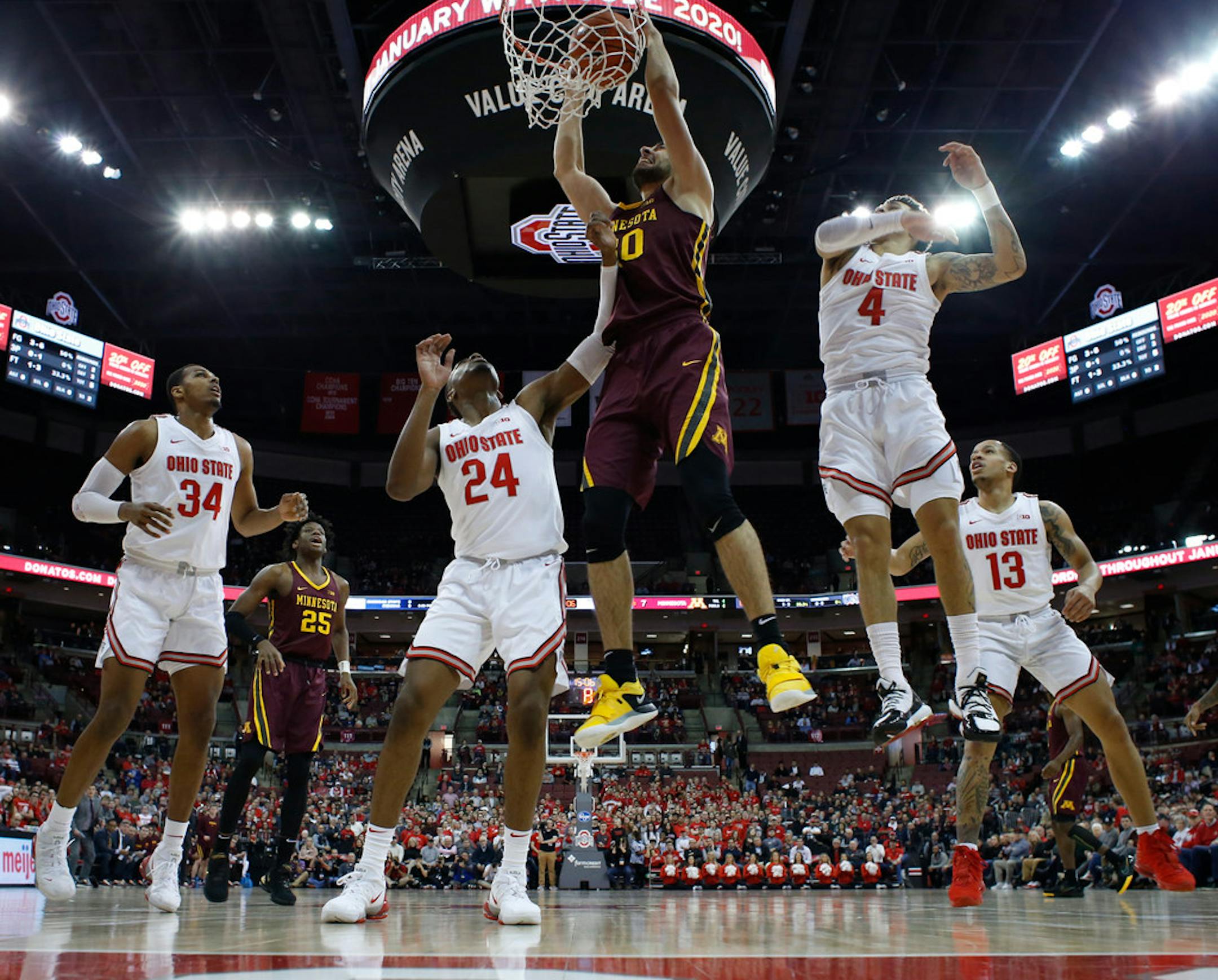 Alihan Demir dunks against Ohio State.
