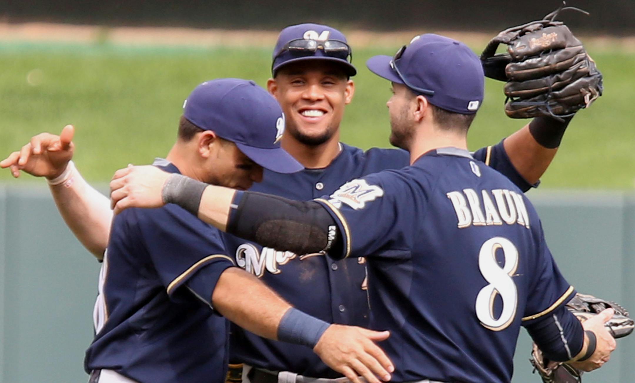 Carlos Gomez #27 of the Milwaukee Brewers, middle celebrated with teammates Ryan Braun #8 of the Milwaukee Brewers, right and Gerardo Parra #28 of the Milwaukee Brewers after their win against the Twins. ] (KYNDELL HARKNESS/STAR TRIBUNE) kyndell.harkness@startribune.com Twins: vs. Milwaukee at Target Field in Minneapolis, Min., Saturday, June 6, 2015. Brewers won 4-2.
