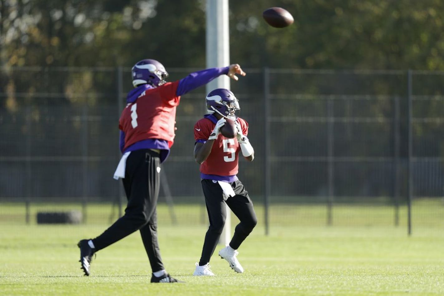 Minnesota Vikings quarterbacks Teddy Bridgewater, right, and Kyle Sloter take part in an NFL training session at the London Irish rugby team training ground in the Sunbury-onThames suburb of south west London, Friday, Oct. 27, 2017. The Minnesota Vikings are preparing for an NFL regular season game against the Cleveland Browns in London on Sunday.