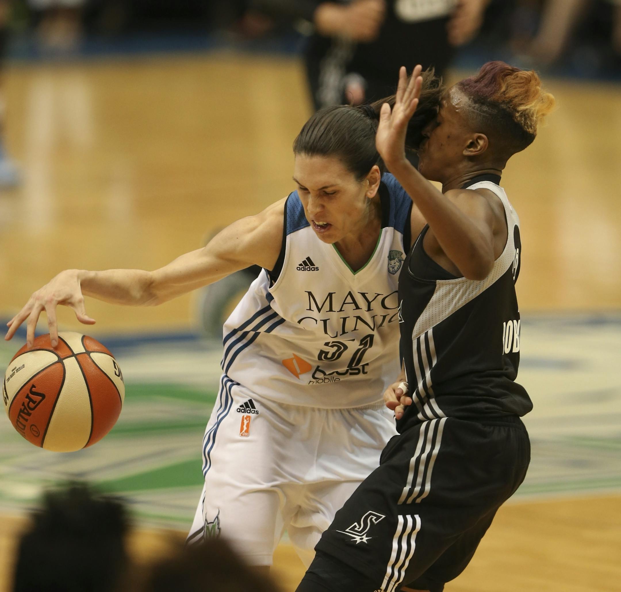 The Lynx' Anna Cruz was called for an offensive foul when she slammed in to the Stars' Danielle Robinson in the first quarter Sunday night at Target Center. JEFF WHEELER � jeff.wheeler@startribune.com The Minnesota Lynx met the San Antonio Stars in an WNBA game Sunday night, July 12, 2015 at Target Center in Minneapolis.