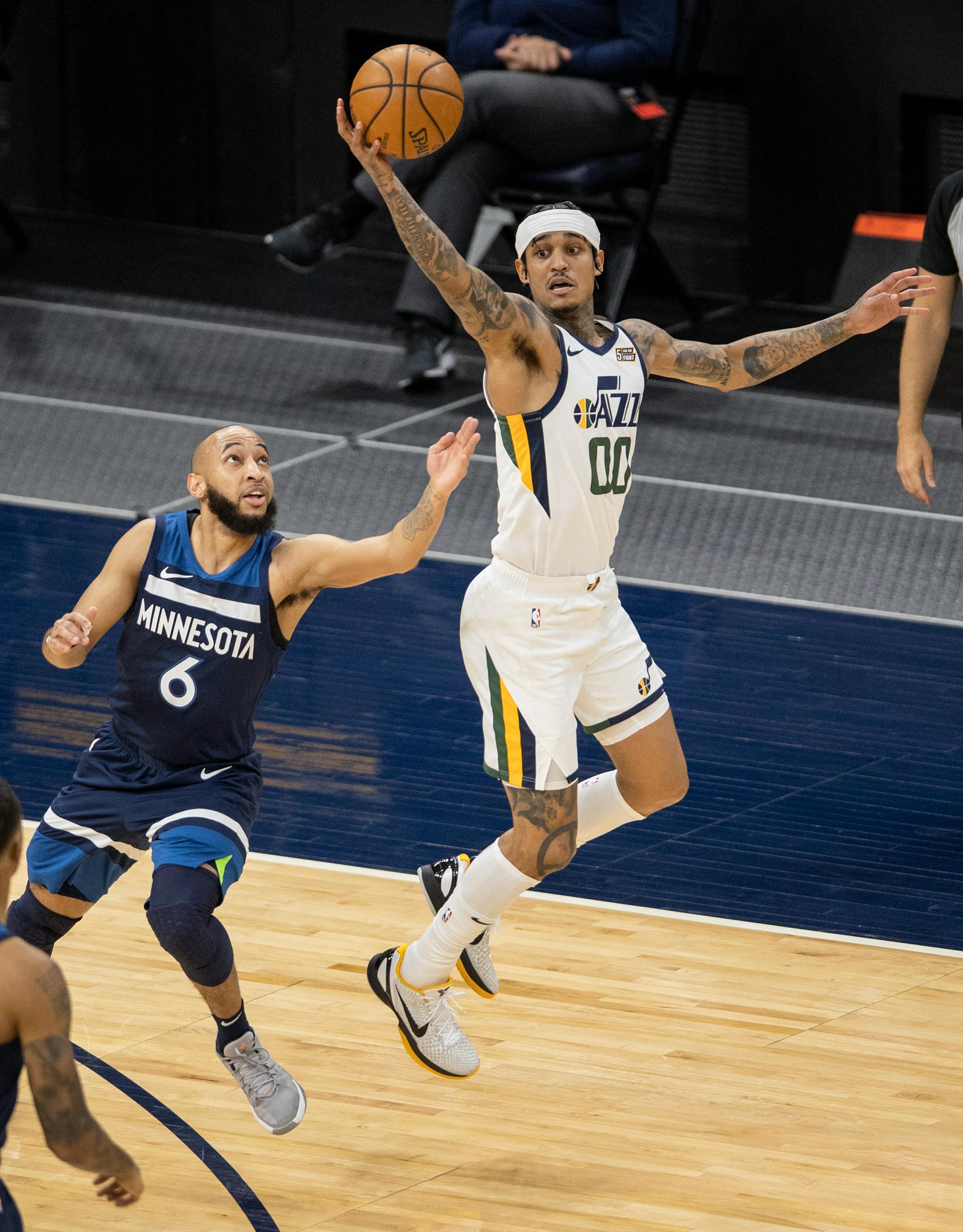 Jordan Mclaughlin (6) of the Minnesota Timberwolves and Jordan Clarkson (00) of the Utah Jazz  fought for the ball in the second quarter.