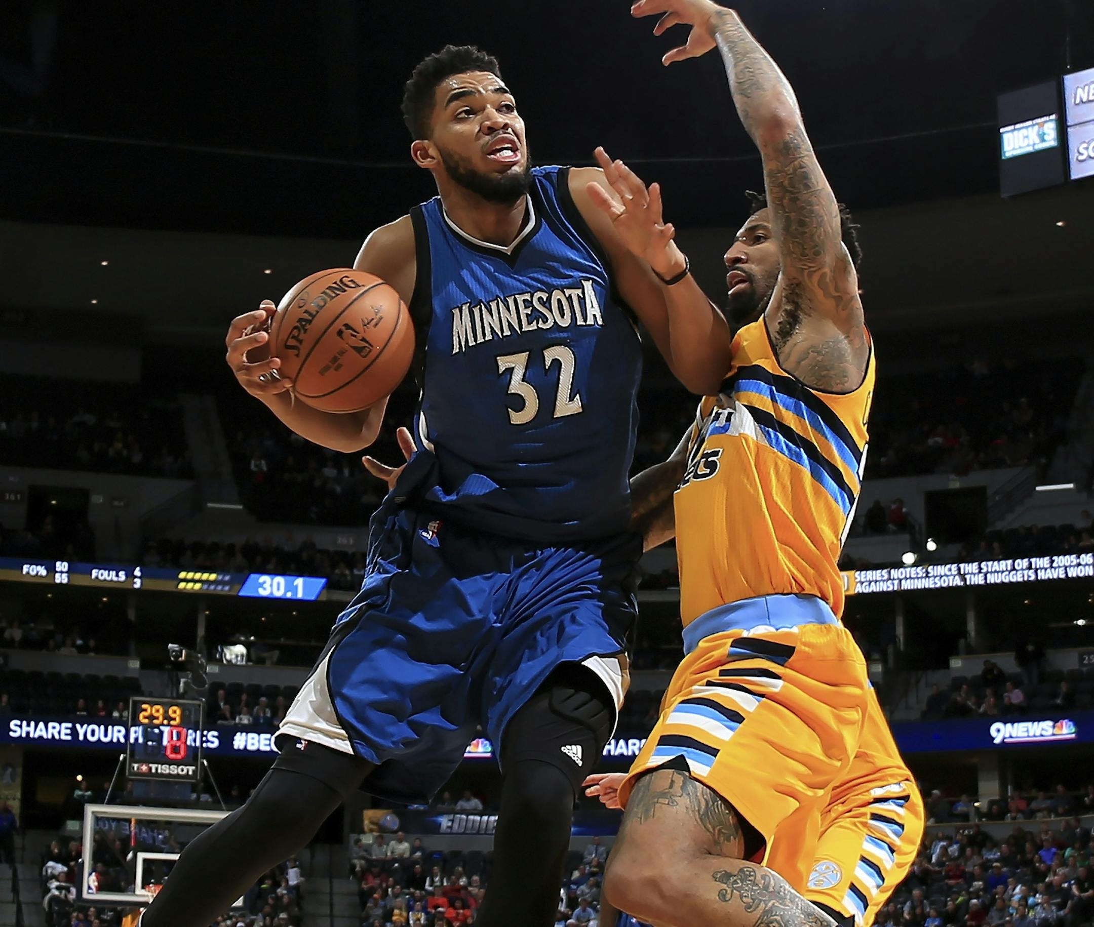 Karl-Anthony Towns, driving on Denver’s Wilson Chandler on Wednesday, was a playmaker for much of the game before scoring 11 fourth-quarter points.