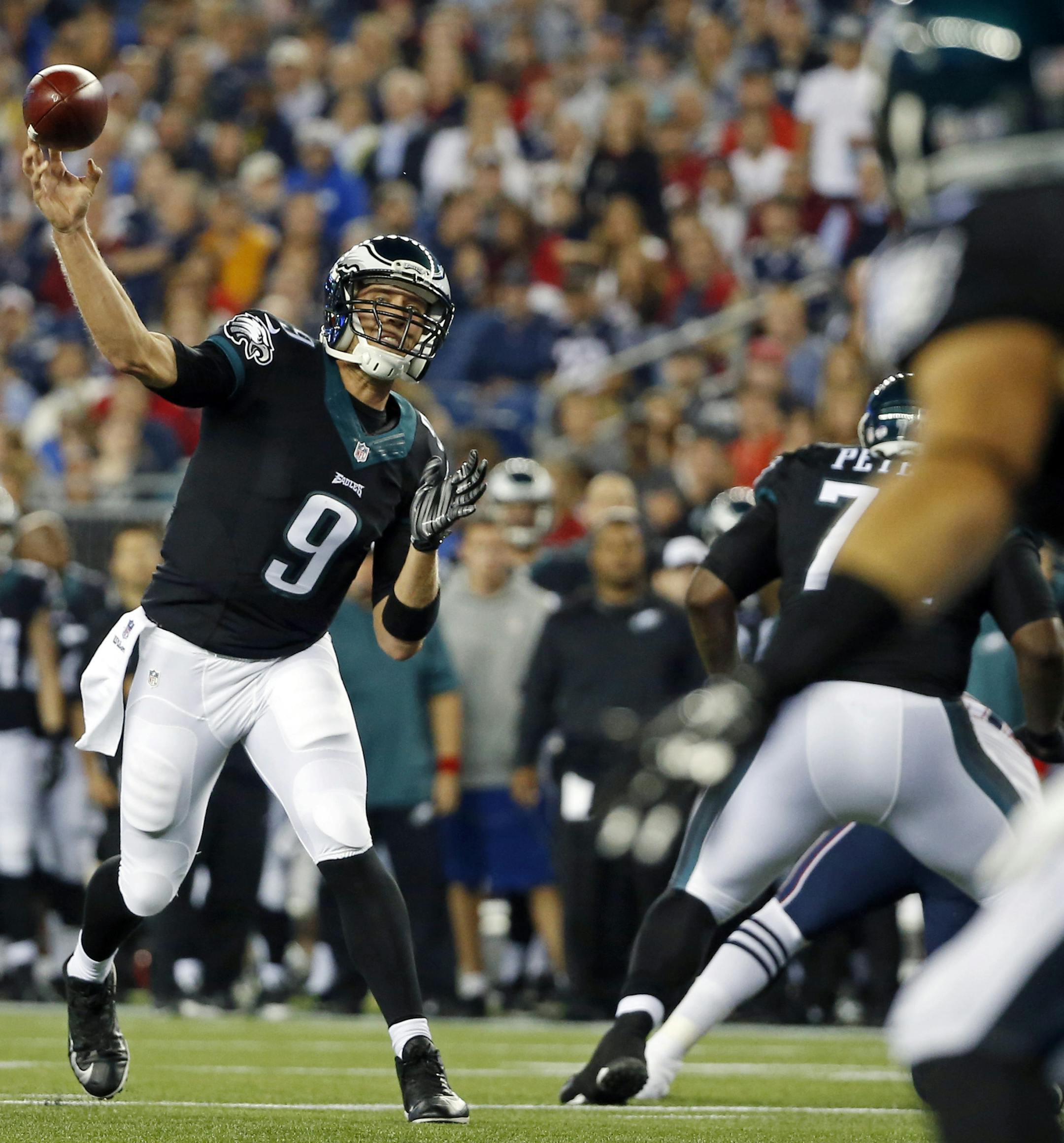 Philadelphia Eagles quarterback Nick Foles (9) throws a pass in the first half of an NFL preseason football game against the New England Patriots Friday, Aug. 15, 2014, in Foxborough, Mass. (AP Photo/Elise Amendola) ORG XMIT: FBO1