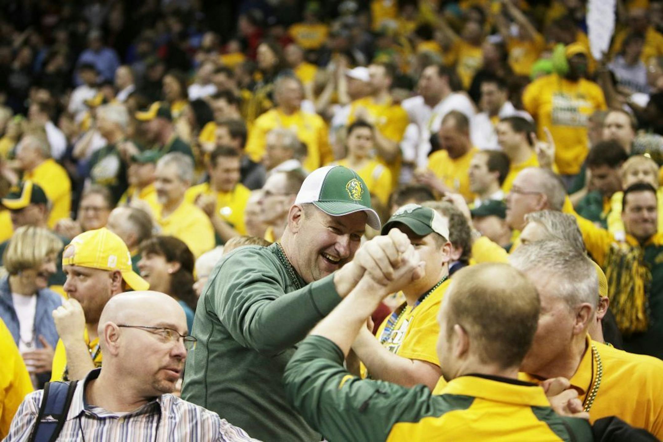 North Dakota State fans celebrate after the second-round game of the NCAA men's college basketball tournament against Oklahoma, in Spokane, Wash., Thursday, March 20, 2014.