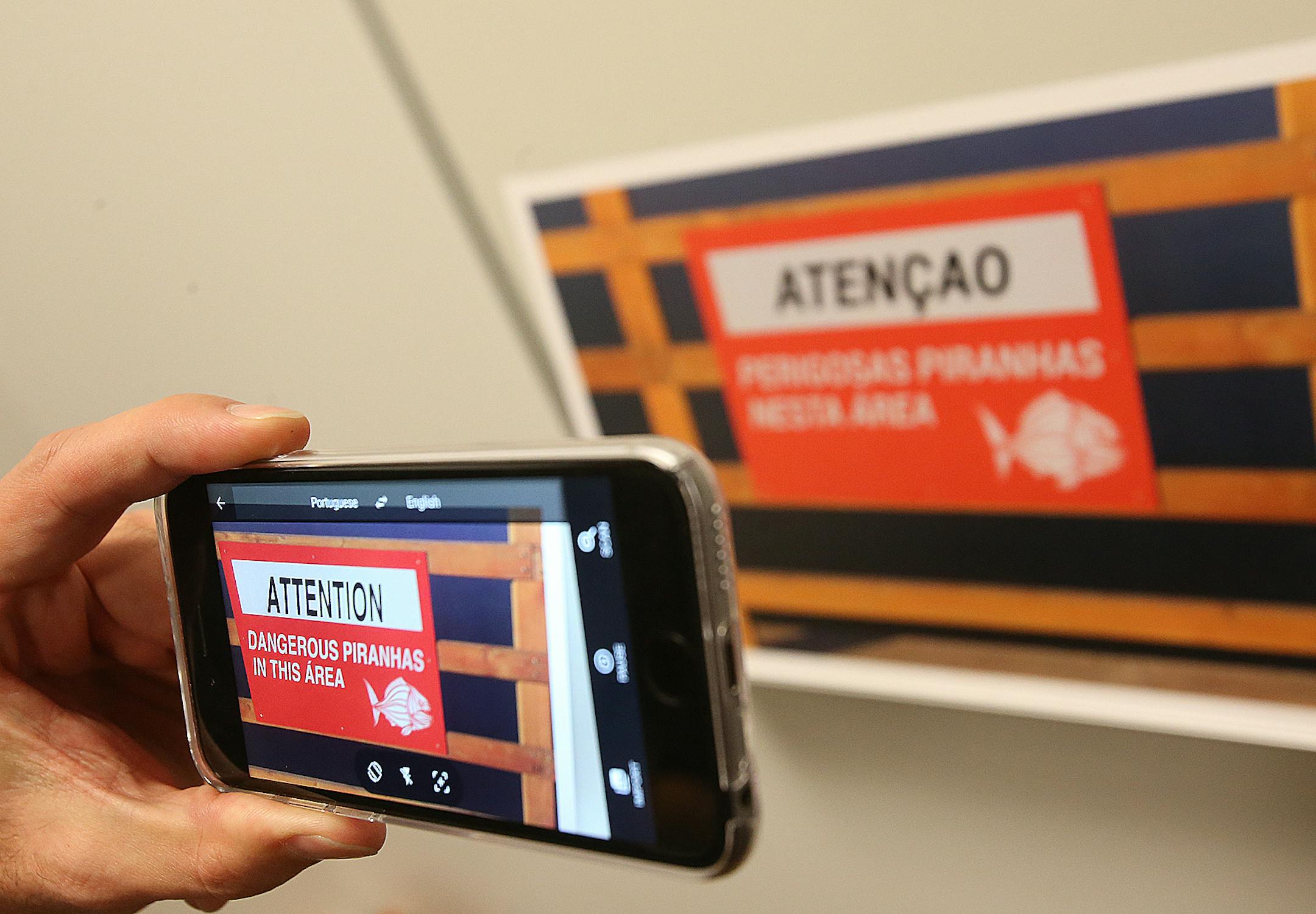 Word Lens founder Otavio Good uses the translate application on a moblie phone to tanslate the words on a sign during a press confernece on Monday, Jan. 12, 2015 in San Francisco, Calif. (Aric Crabb/Bay Area News Group)