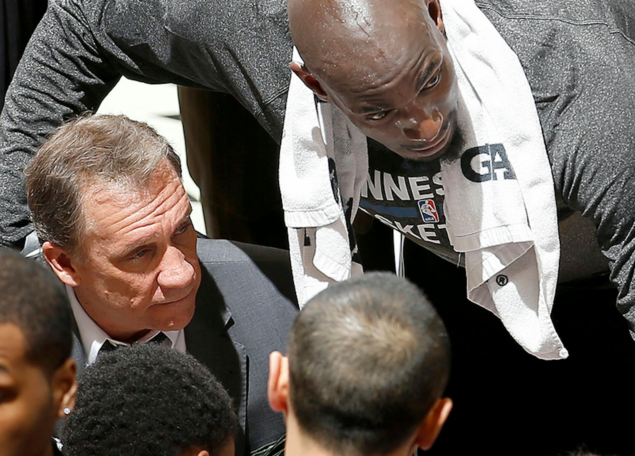 Flip Saunders and Kevin Garnett spoke to the team during a timeout in the third quarter. March, 2015
