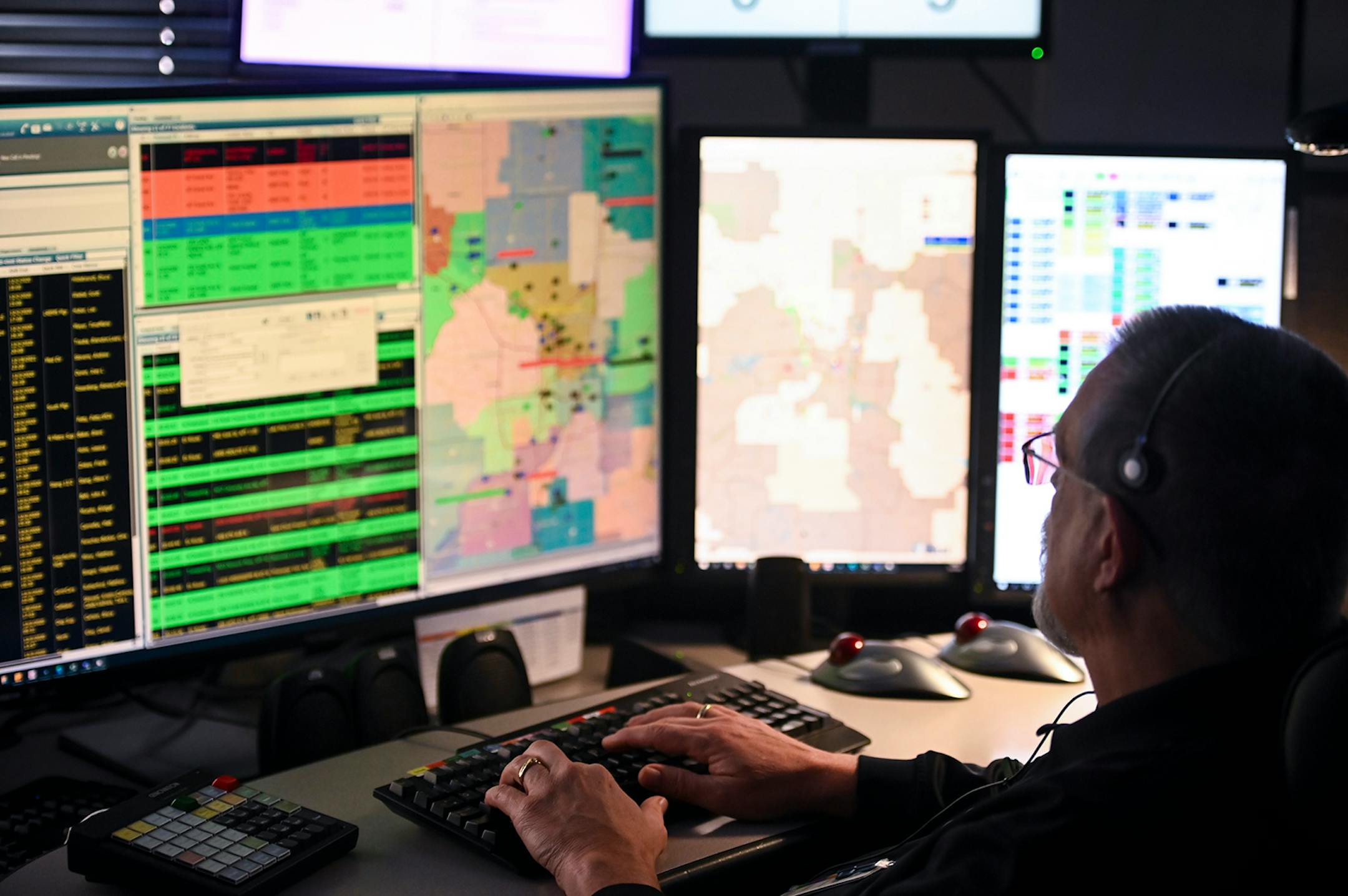 Bryce Carlson, a dispatch duty supervisor with Allina Health, worked in Allina Emergency Medical Services' St. Paul dispatch center Wednesday afternoon. ] AARON LAVINSKY • aaron.lavinsky@startribune.com Emergency medical workers and physician Andrew Stevens responded to possible COVID-19 related calls on Wednesday, Dec. 2, 2020 in the north Twin Cities metro.