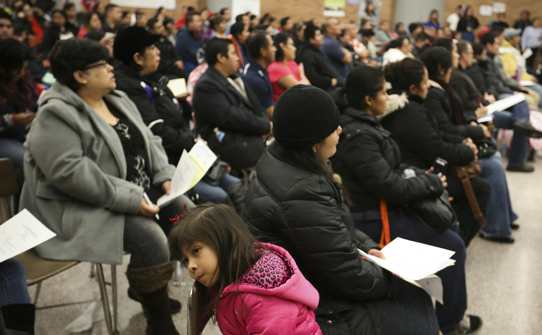 A crowd of close to 200 people attended at an informational meeting on applying for work permits and deportation relief under Obama's executive order at Richfield High School in Richfield, Minn. on Thursday, December 18, 2014. ] RENÉE JONES SCHNEIDER reneejones@startribune.com