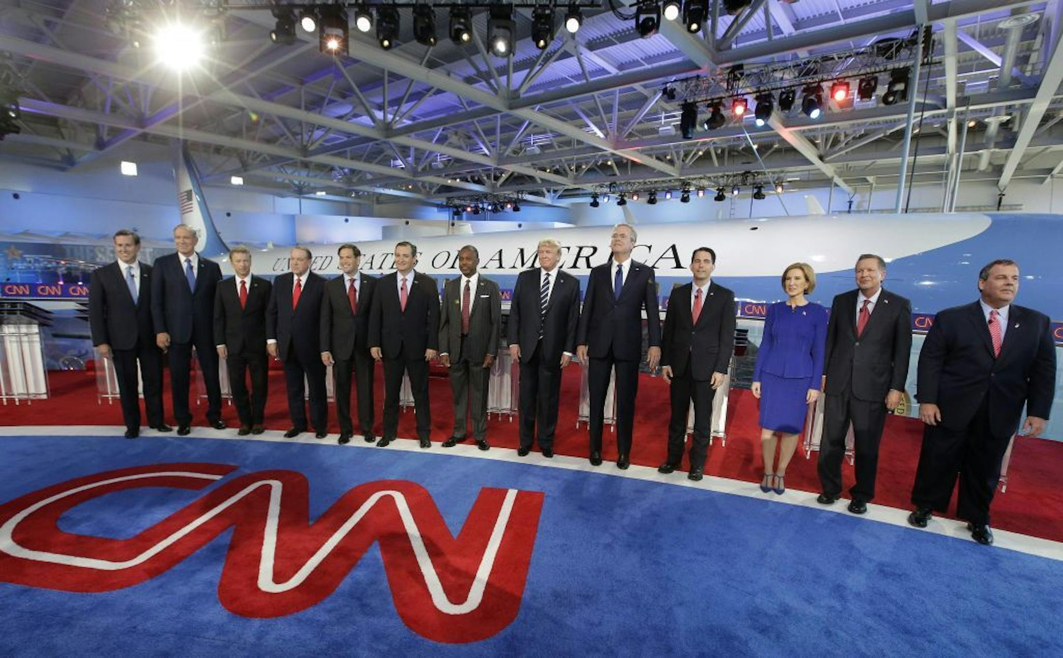 Republican presidential candidates, from left, former Pennsylvania Sen. Rick Santorum, former New York Gov. George Pataki, Sen. Rand Paul, R-Ky., former Arkansas Gov. Mike Huckabee, Sen. Marco Rubio, R-Fla., Sen. Ted Cruz, R-Texas, retired neurosurgeon Ben Carson, businessman Donald Trump, former Florida Gov. Jeb Bush, Wisconsin Gov. Scott Walker, businesswoman Carly Fiorina, Ohio Gov. John Kasich, and New Jersey Gov. Chris Christie take the stage during the CNN Republican presidential debate at