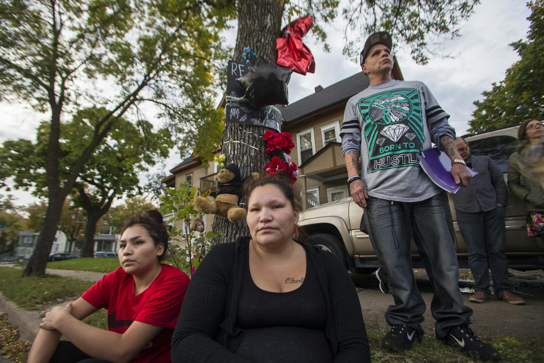 Julia Johnson, Gustav Christianson's older sister, and her daughter Angelina Flores (left), and Christianson's older bother Gomer Thompson gathered in 2016 at the memorial site for Christianson. Family and community members held a vigil at the scene where 20-year-old Gustav D. Christianson and 7-month-old Jayden Redden were killed on Oct. 9, 2016 by Jquan McInnis.
[Mark Vancleave - mark.vancleave@startribune.com] ORG XMIT: MIN1610101917460935