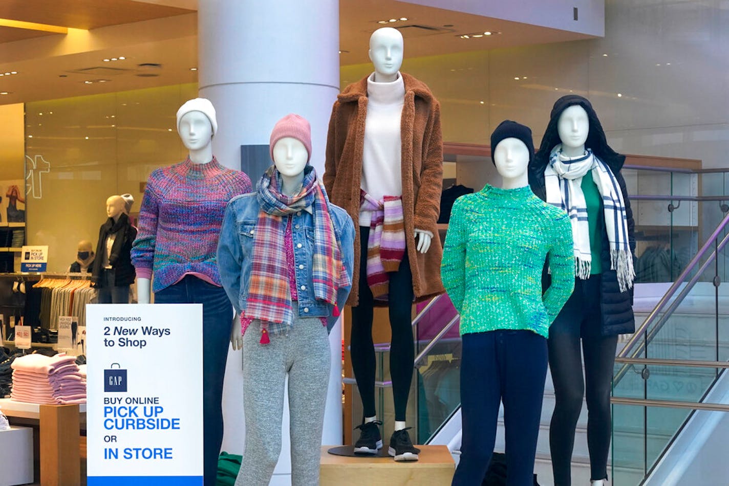 Mannequins stand on display Wednesday, Nov. 18, 2020, at The Gap store on Michigan Avenue in Chicago.