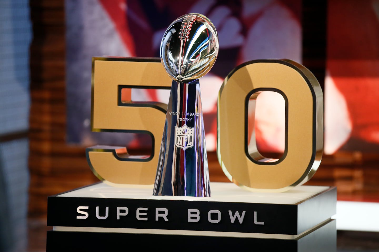 The Vince Lombardi Trophy stands in front of the No. 50, the number of the Super Bowl following the upcoming season.