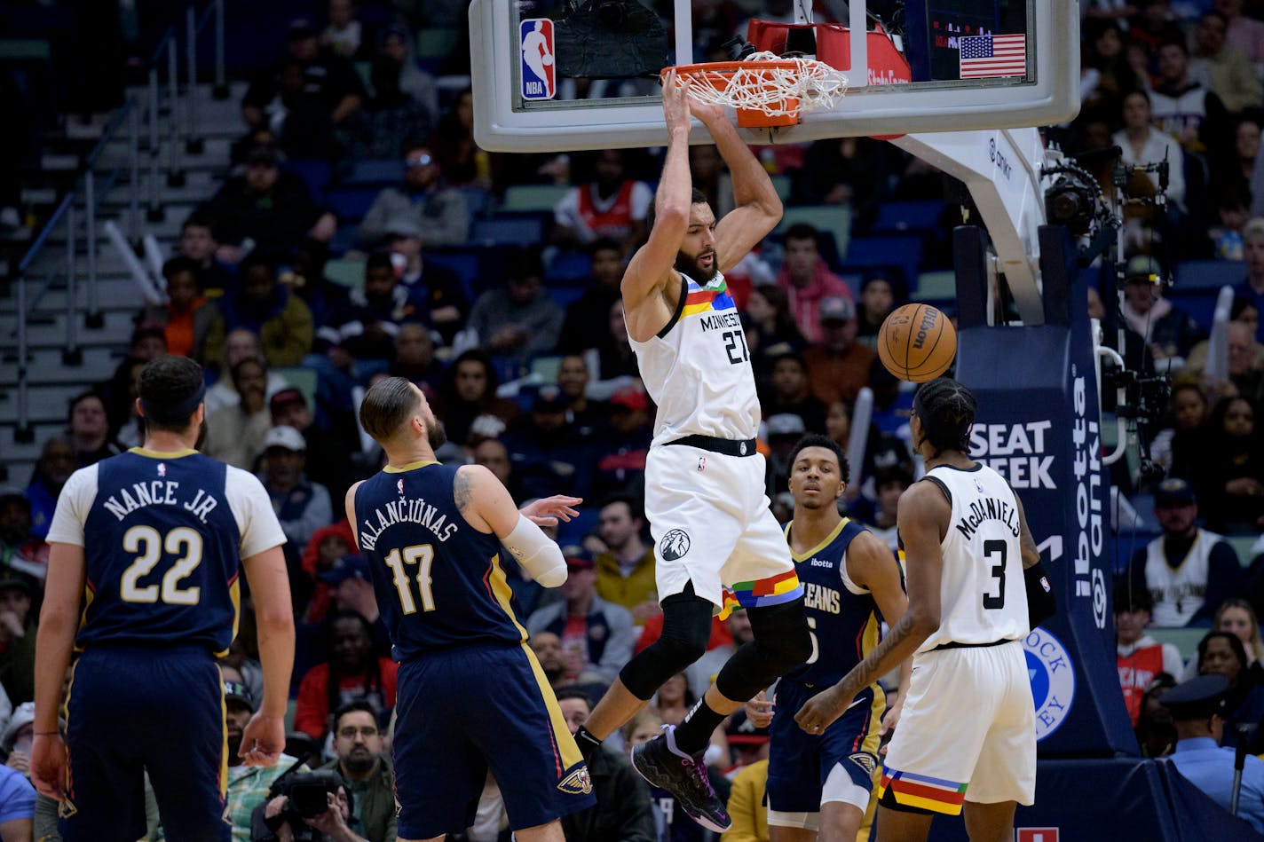 Timberwolves center Rudy Gobert dunks against Pelicans guard Trey Murphy III during the first half Wednesday