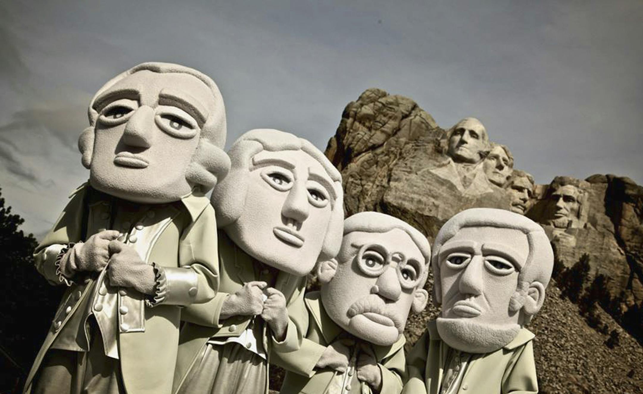 This undated photo provide by the South Dakota Department of Tourism shows The Mount Rushmore Mascots posing at the Mount Rushmore National Memorial in Keystone, S.D. The mascots are†playing a big role in†South Dakota's efforts to draw tourists to the state this year.†(AP Photo/Courtesy of the South Dakota Department of Tourism)