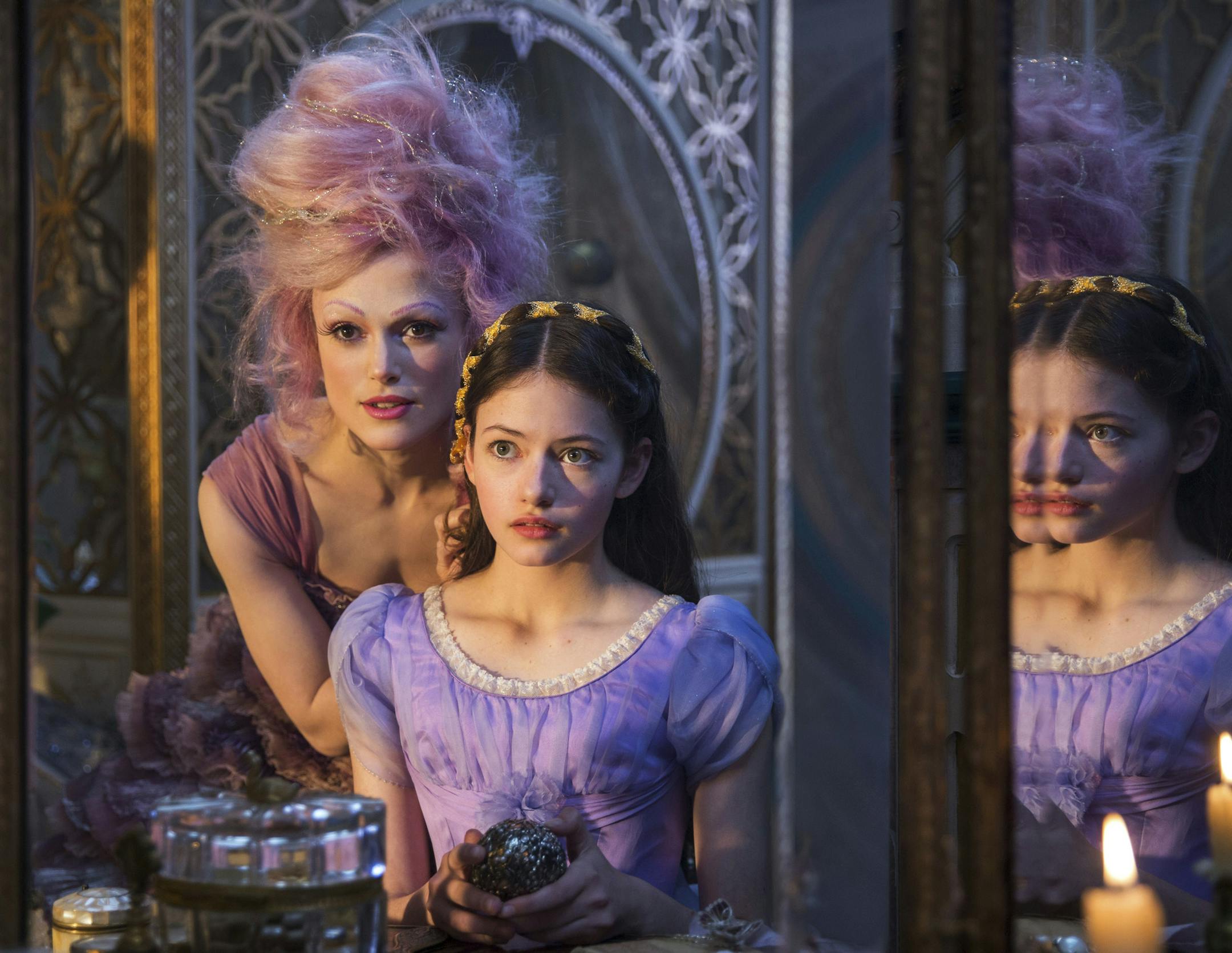 This image released by Disney shows Keira Knightley, left, and Mackenzie Foy in a scene from "The Nutcracker and the Four Realms." (Laurie Sparham/Disney via AP)