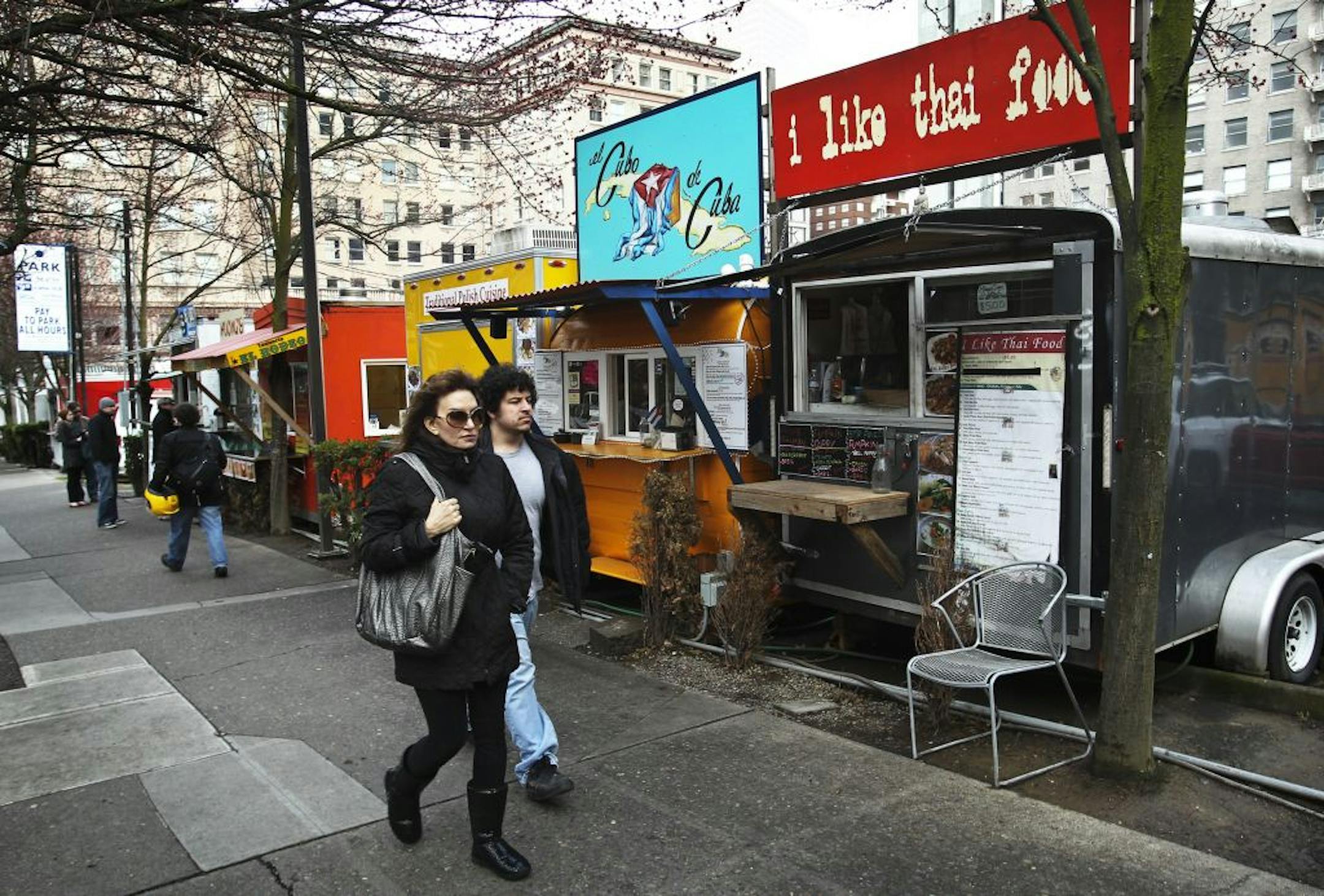Food trucks line a street in Portland's city center.