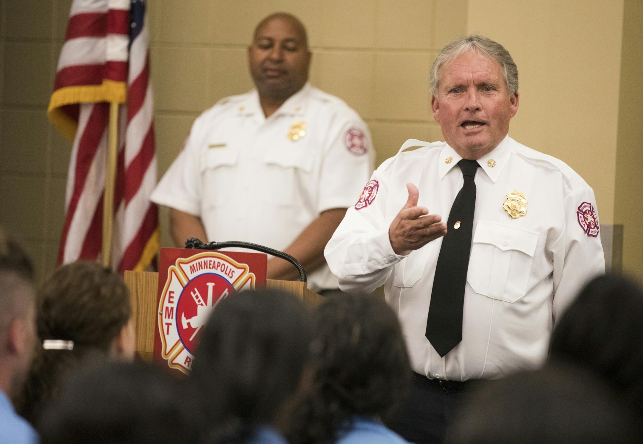 Minneapolis fire chief John Fruetel speaks during the graduation ceremony.