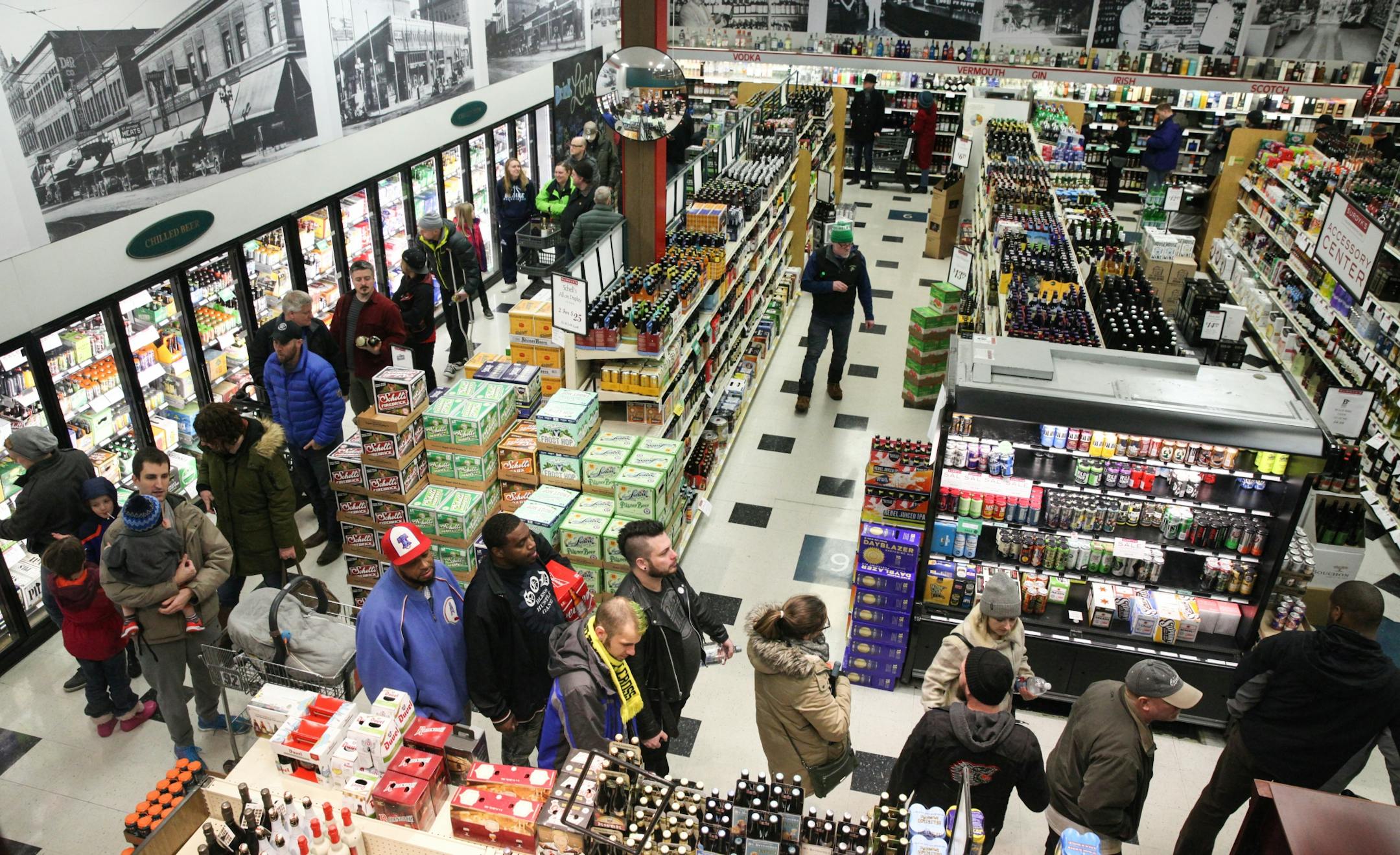The line is wrapped all the way around the inside of the Surdyk's liquor store on Sunday. March 12, 2017.