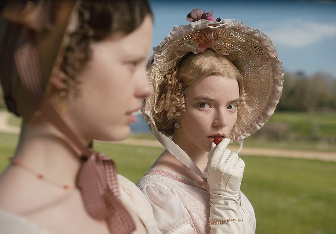 Anya Taylor-Joy (right, with Mia Goth) as "Emma."