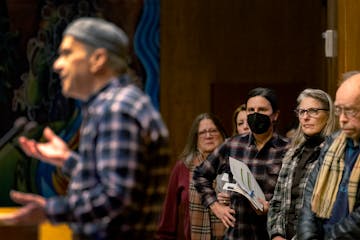 St. Paul residents stood in line to speak during the truth in taxation meeting Tuesday at City Hall. 