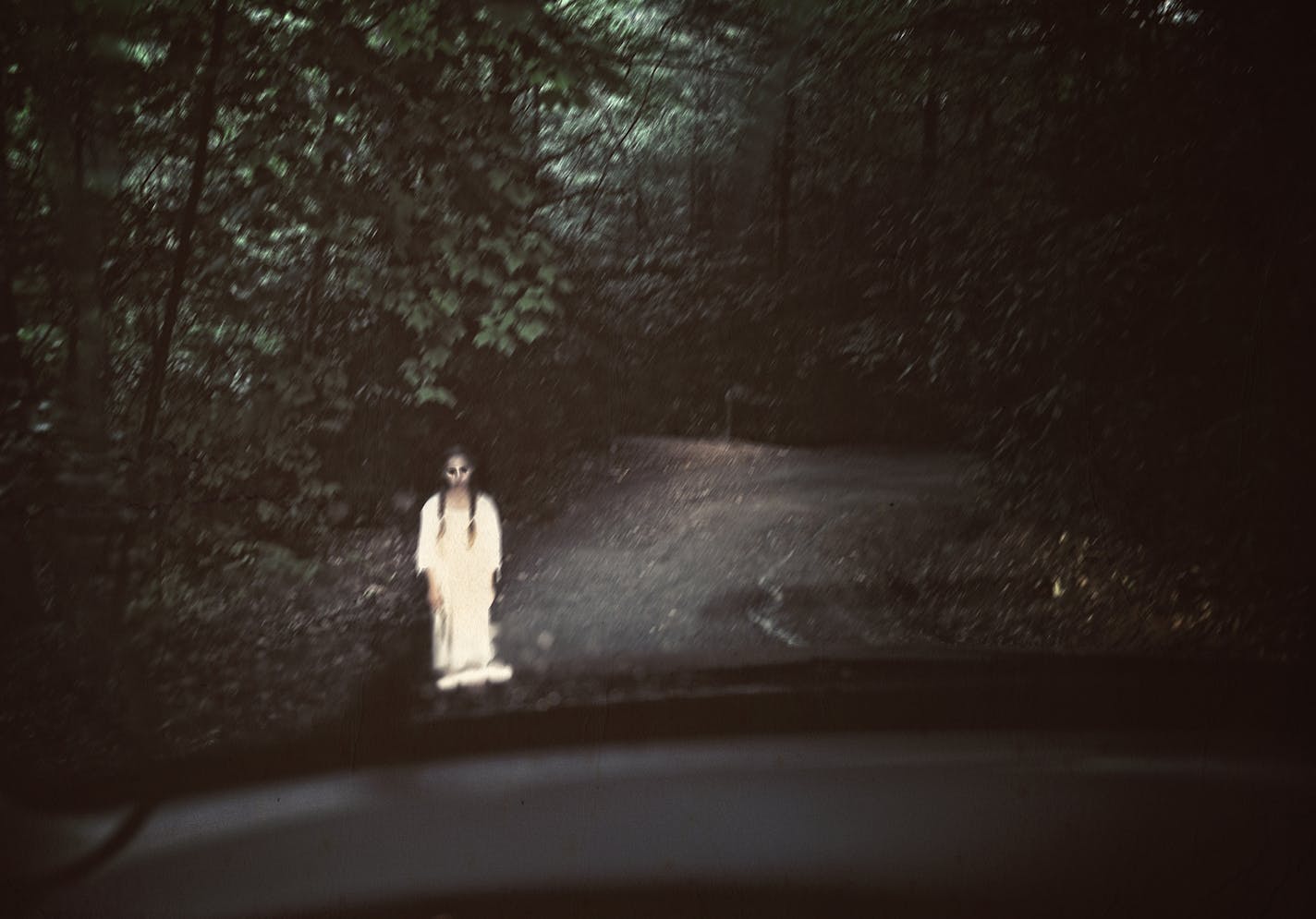 Based on a North Carolina legend, this young girl was killed on a dark rainy evening such as this by a passing car. She silently pleads for a ride to find her way back home.