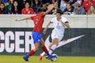 Costa Rica defender Maria Coto (left) defended as United States forward Christen Press dribbled with the ball during the first half of a CONCACAF wome
