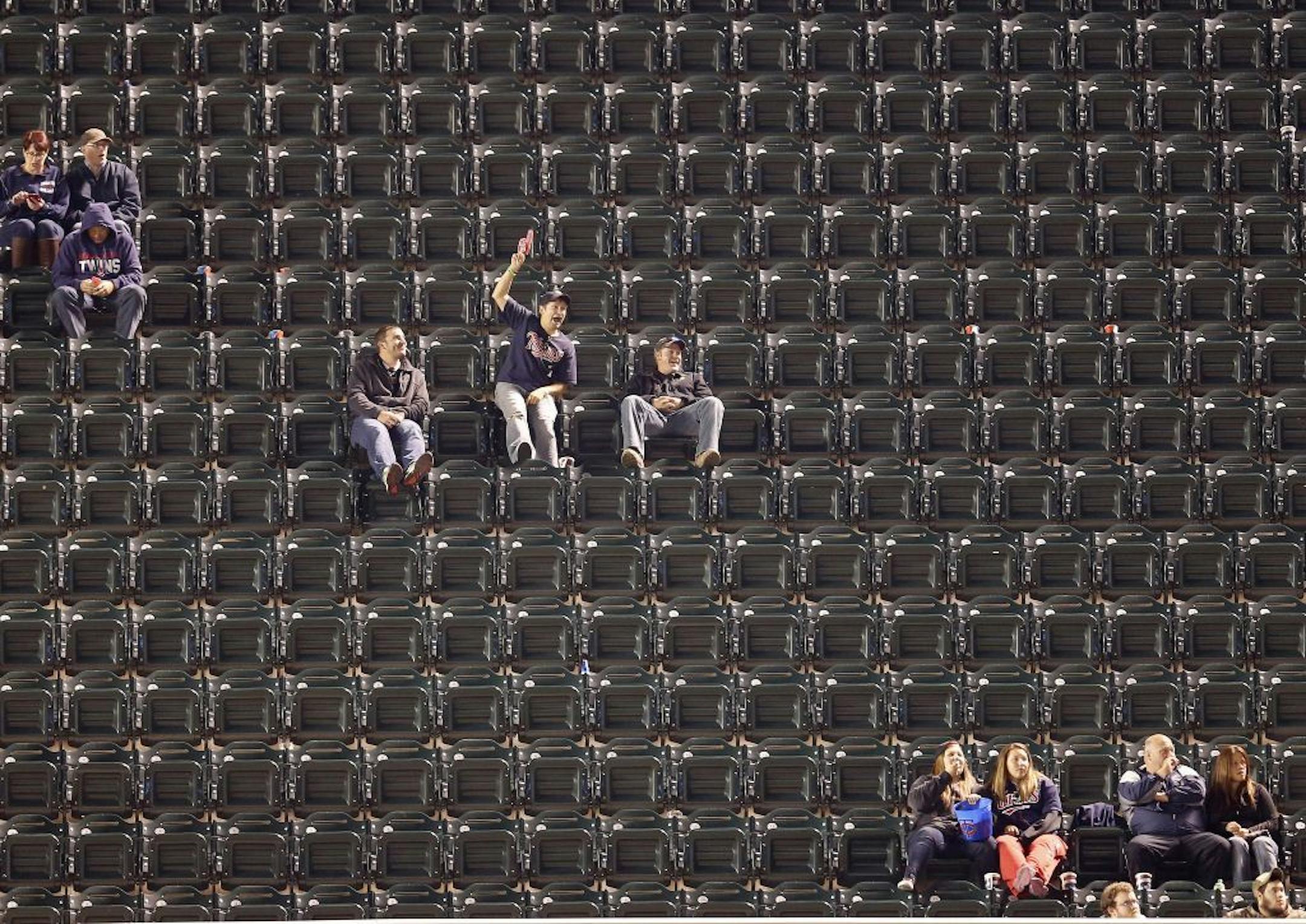 Fans in the upper left field deck watched the game in the eighth inning. Detroit beat Minnesota by a final score 8-6.