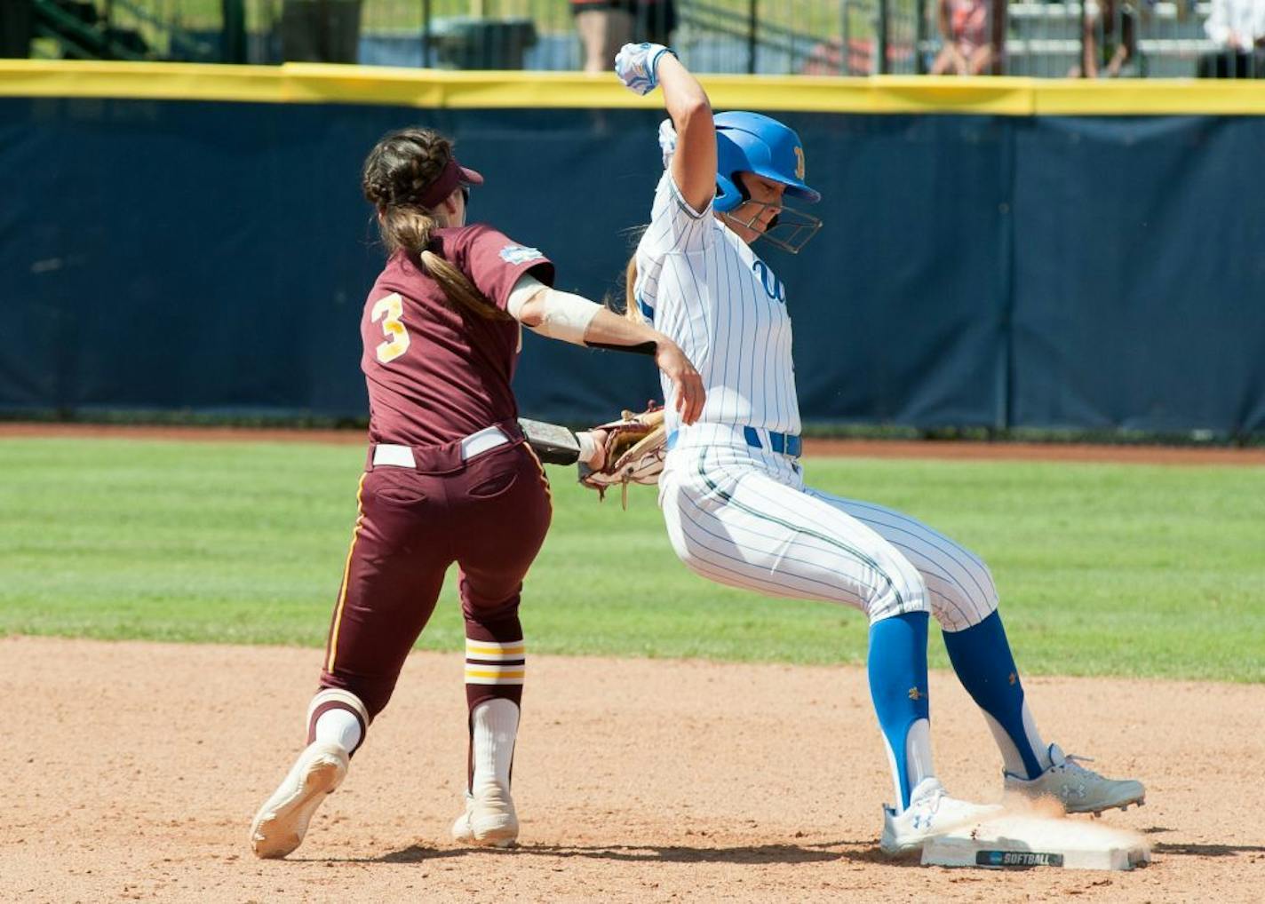 MaKenna Partain tags a UCLA baserunner during Thursday's loss to UCLA.