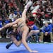 Chase Mills of St. Michael-Albertville takes down Stillwater's Mikey Jelinek in a 106 LB bout during the Class 3A Minnesota High School Wrestling Team