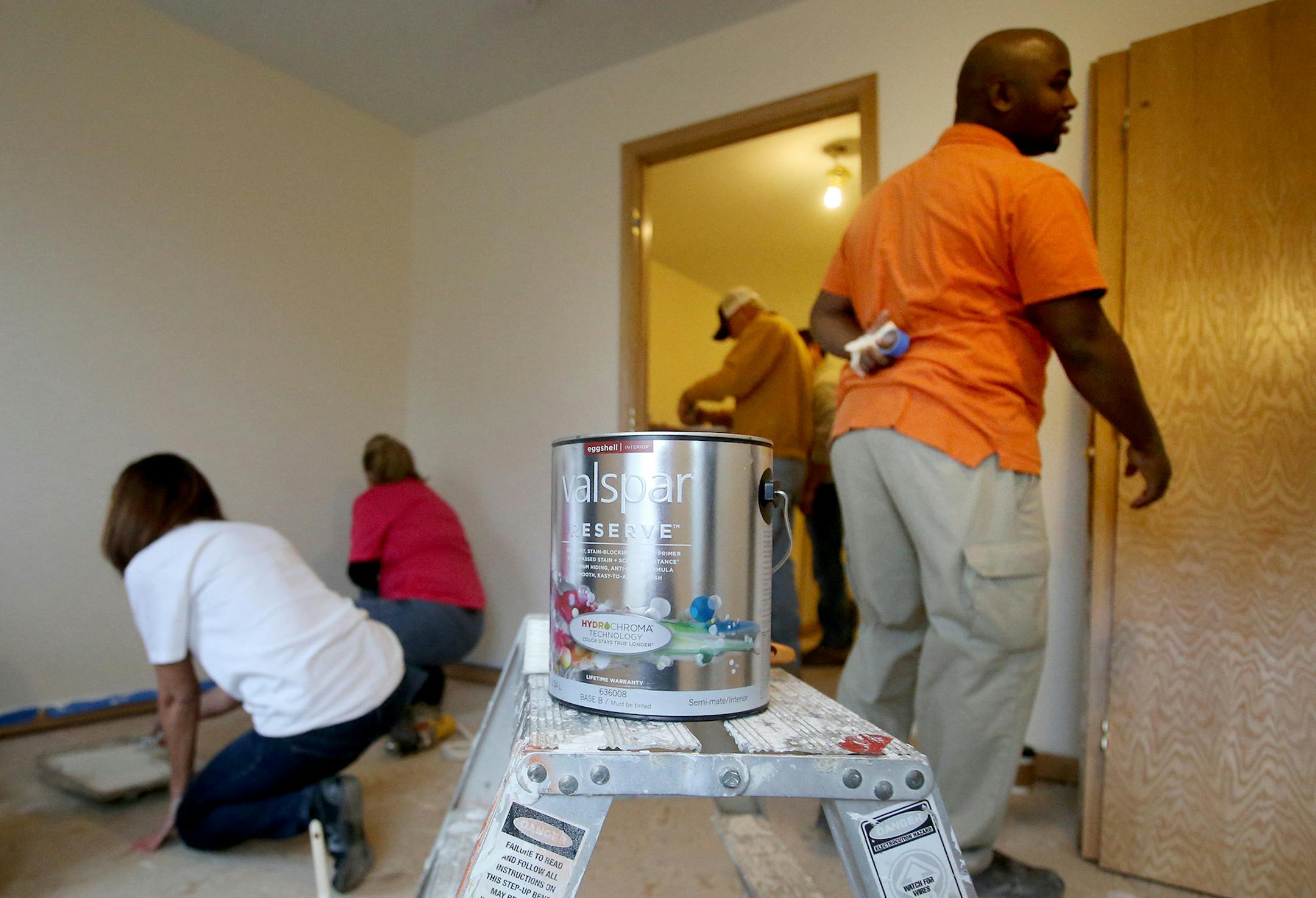 Valspar employees volunteered to paint rooms inside a Habitat for Humanity house Thursday, March 19, 2015, in Minneapolis, MN. Here, Valspar volunteers and owner Hamza Ibrahim, right, worked.](DAVID JOLES/STARTRIBINE)djoles@startribune.com Valspar to donate $36 million in paint to Habitat For Humanity. Gift brings its total donations to $100 million since it began donating paint for house building projects. (EDITOR'S NOTE: OWNER GAVE HIS NAME AS HAMZA IBRHIM; HOWEVER, A GOOGLE SEARCH OF THAT NAM