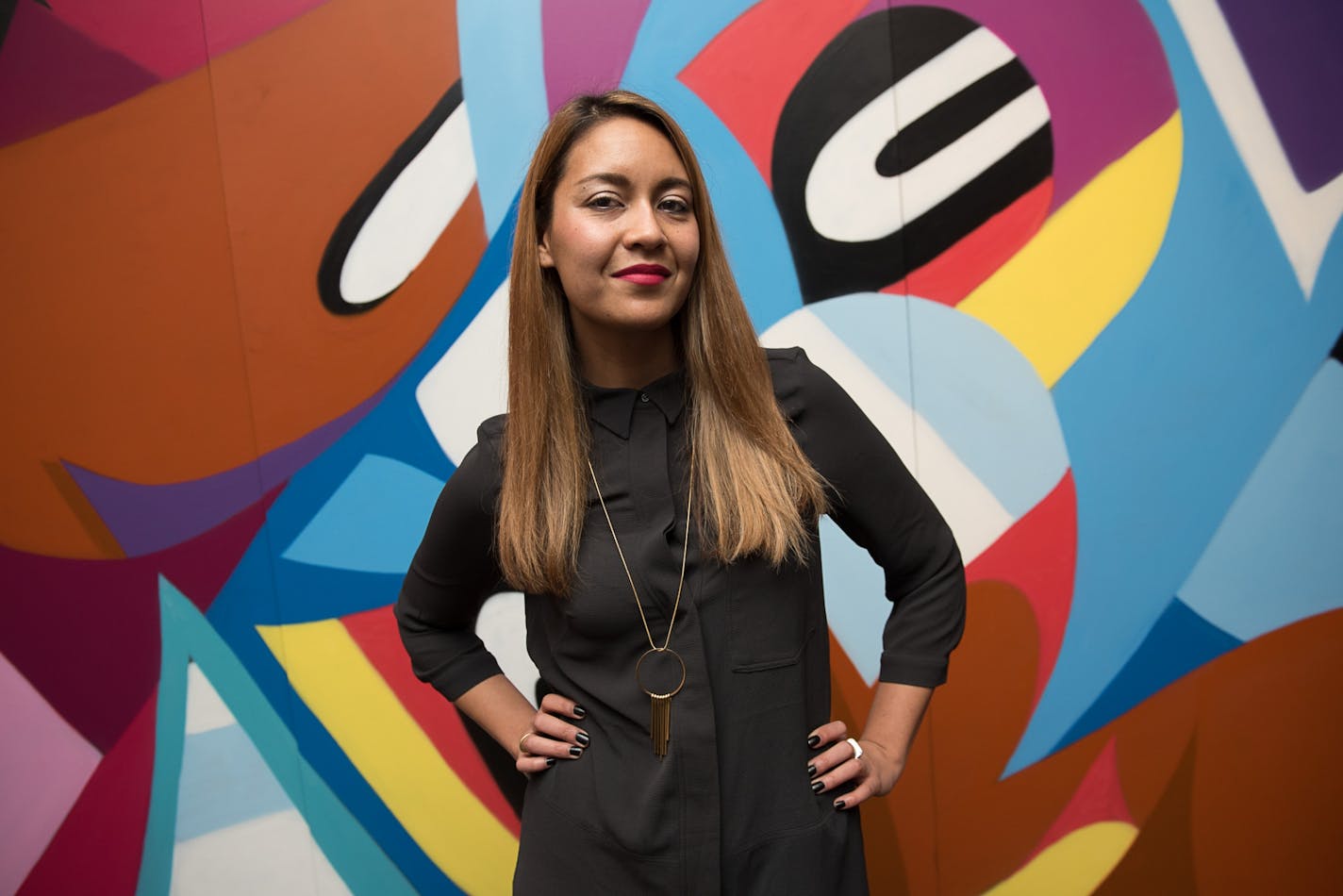 Curator Tricia Khutoretsky stands for a portrait at the opening of the Erik Inkala show at Public Functionary in Minneapolis on November 22, 2014. [ Angela Jimenez/Special to the Star-Tribune angelajime@gmail.com Assignment #20037094A_ SLUG: PUBLIC120914_ EXTRA INFORMATION: Tricia Khutoretsky, who finds the idea of a straight-up art opening outdated, is the curator of the northeast-Minneapolis combo gallery and gathering spot Public Functionary. The Thai-born, Egypt-raised entrepreneur and her c