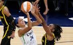Lynx forward Napheesa Collier shoots over Los Angeles Sparks forward Nneka Ogwumike during the first quarter Thursday