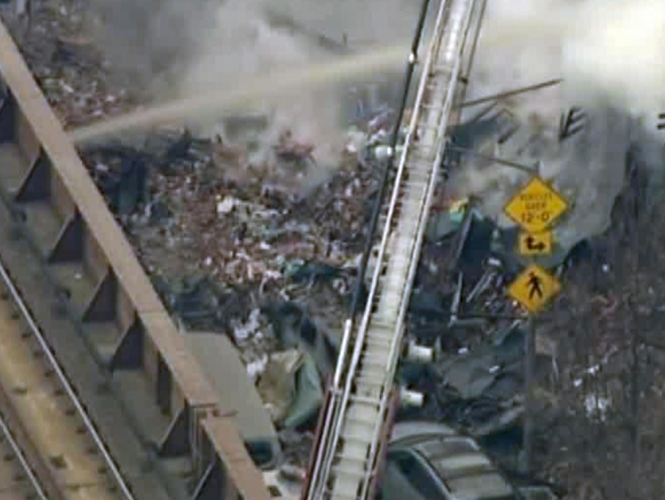 In this image taken from video from WABC, firefighters battle a blaze at the site of a possible explosion and building collapse in the East Harlem neighborhood of New York, Wednesday, March 12, 2014.