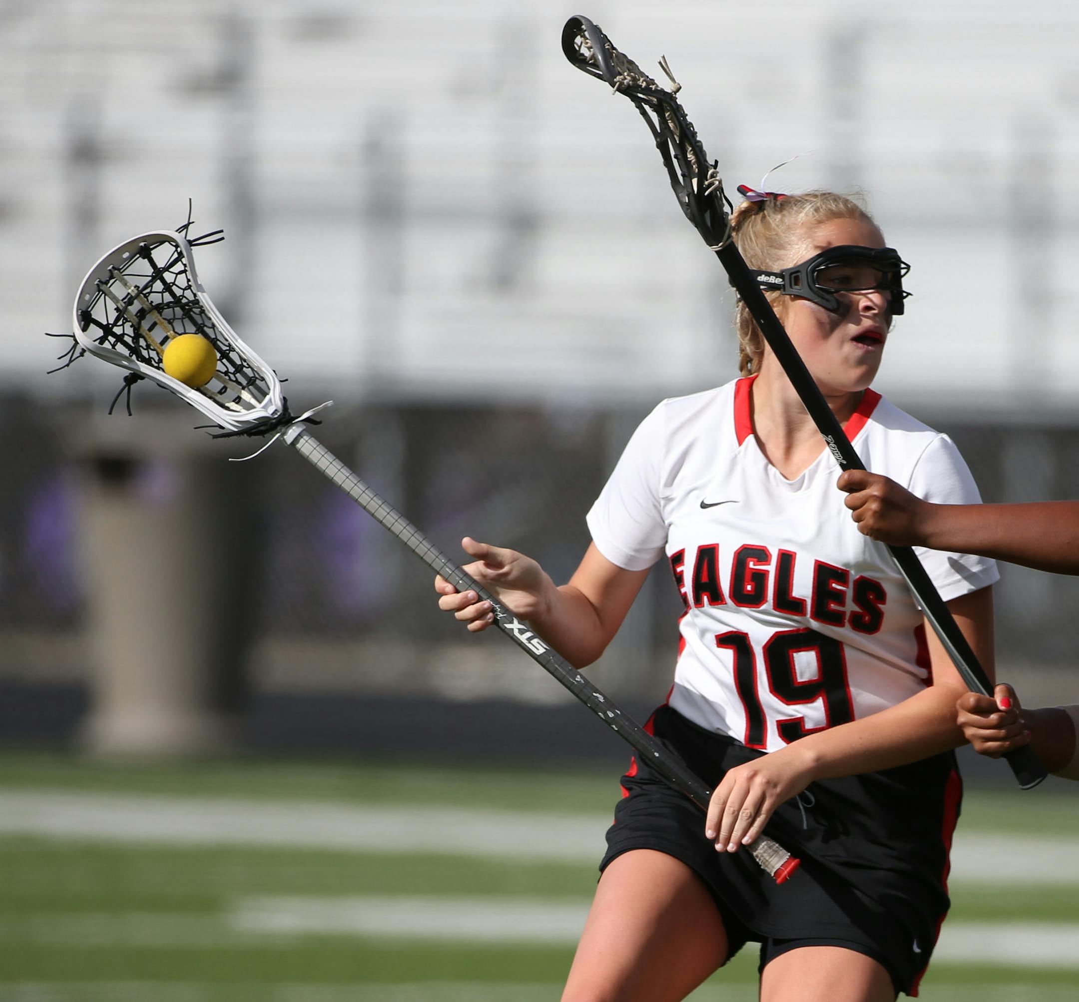 Eden Prairie's Jessica Lagerquist looked to score against Apple Valley's Kelly Mutua during second half action. ] (KYNDELL HARKNESS/STAR TRIBUNE) kyndell.harkness@startribune.com Girls' lacrosse semifinals Eden Prairie 13, Apple Valley 6 in Chaska, Min.Thursday, June 12, 2014.