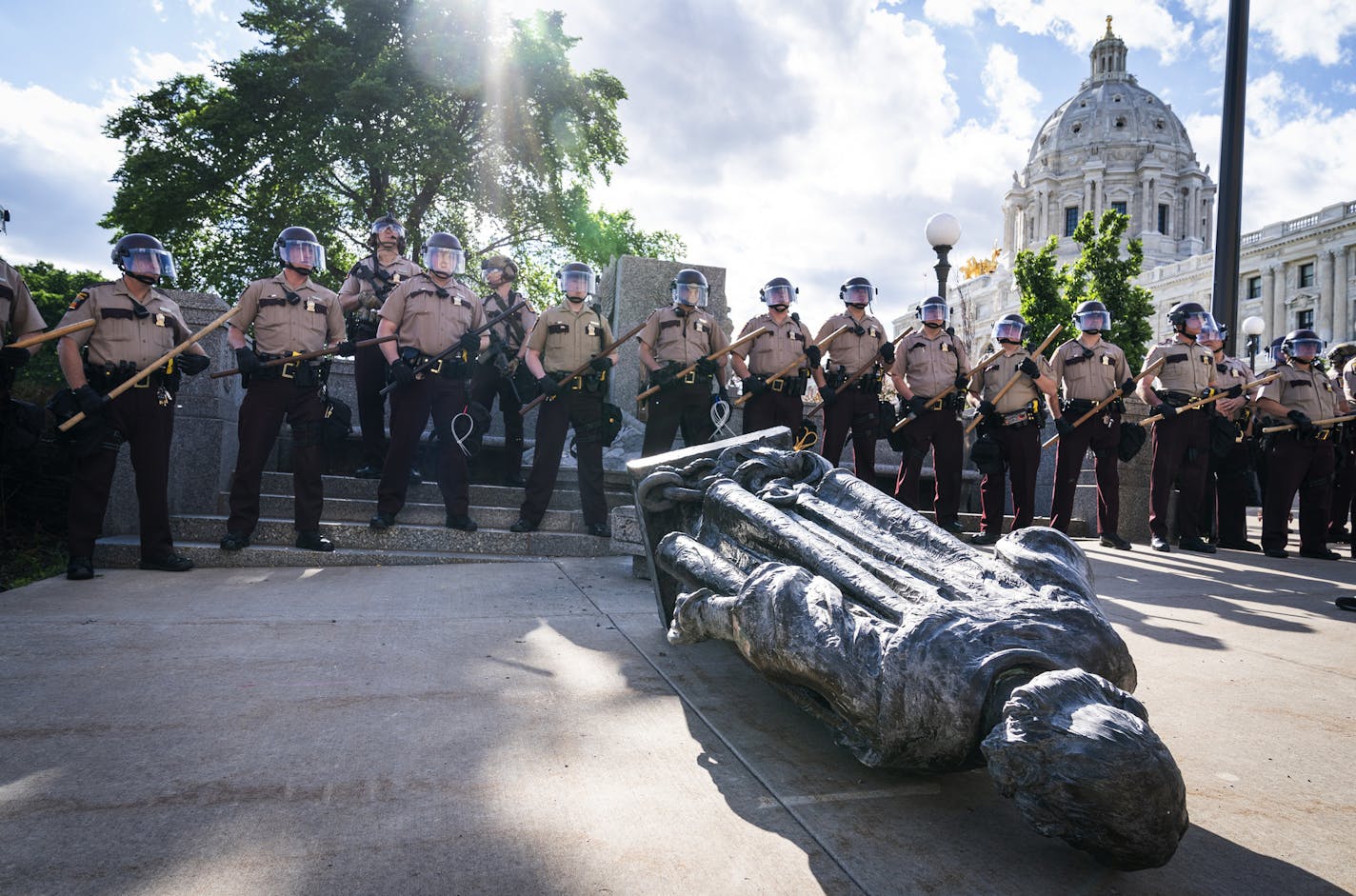 State troopers surrounded the toppled statue of Christopher Columbus at the Minnesota Capitol in June.