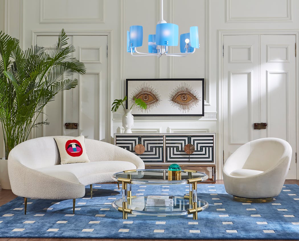 Jonathan Adler’s Wondrium decorating series emphasizes expressing your own personality in your home. Here, his Ether curved sofa with stiletto legs and his “Eyes” wall art are two strong statement pieces.
