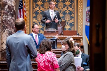 Sen. Patricia Torres Ray, DFL-Minneapolis talked with Senate Minority Leader Susan Kent, DFL-Woodbury as Senate President Jeremy Miller, R-Winona prep