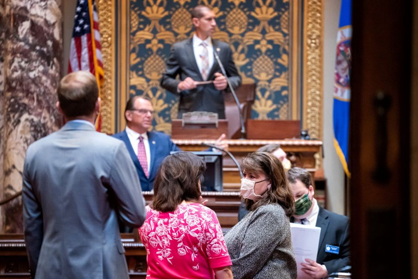 Sen. Patricia Torres Ray, DFL-Minneapolis talked with Senate Minority Leader Susan Kent, DFL-Woodbury as Senate President Jeremy Miller, R-Winona prepared to gavel the Senate into session on July 13. Democrats need to flip two Senate seats to gain control of both chambers.