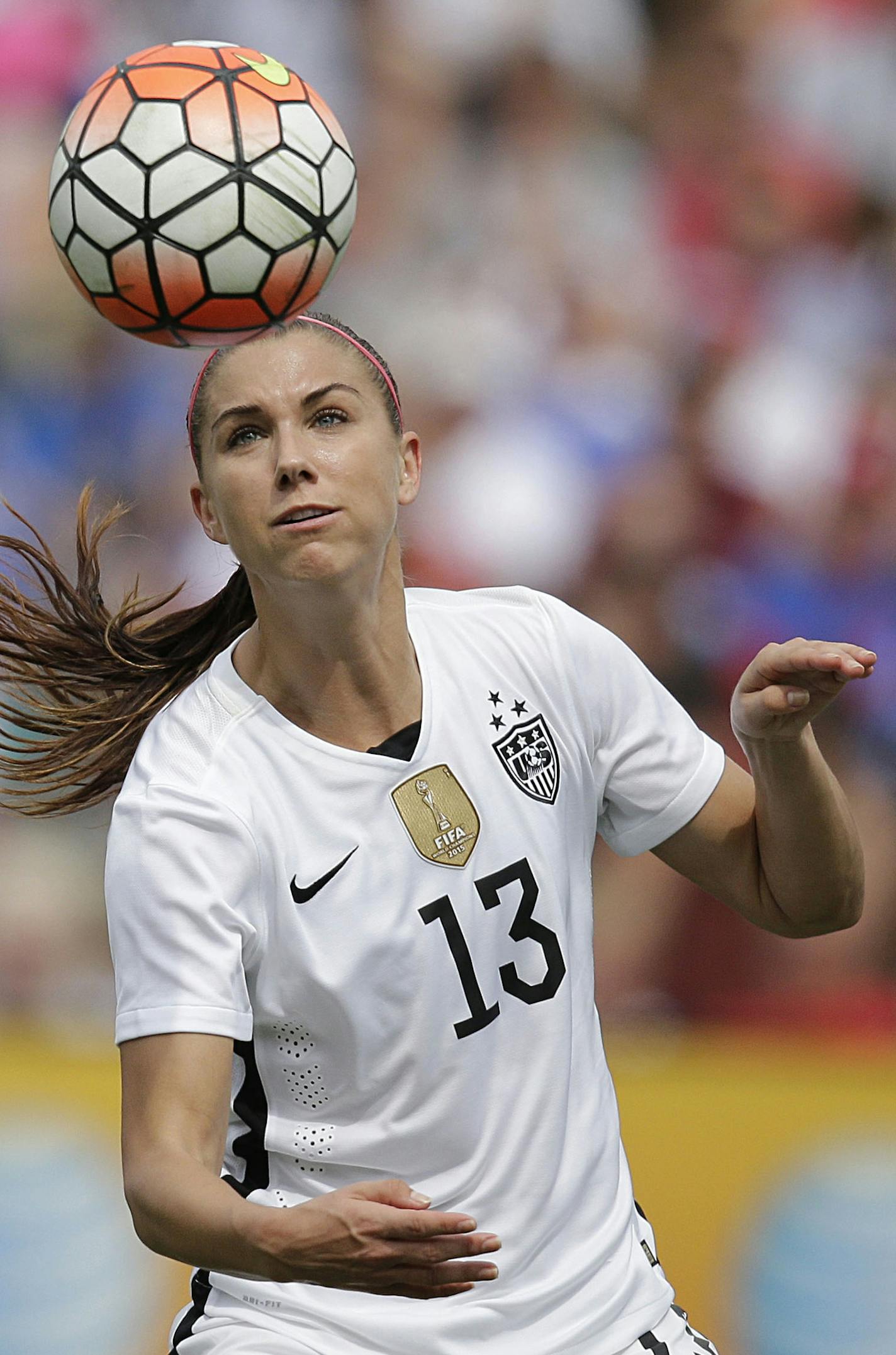 United States' Alex Morgan heads the ball agasint Haiti during the U.S. Women's World Cup victory tour, Sunday, Sept. 20, 2015, in Birmingham, Ala. (AP Photo/Brynn Anderson)