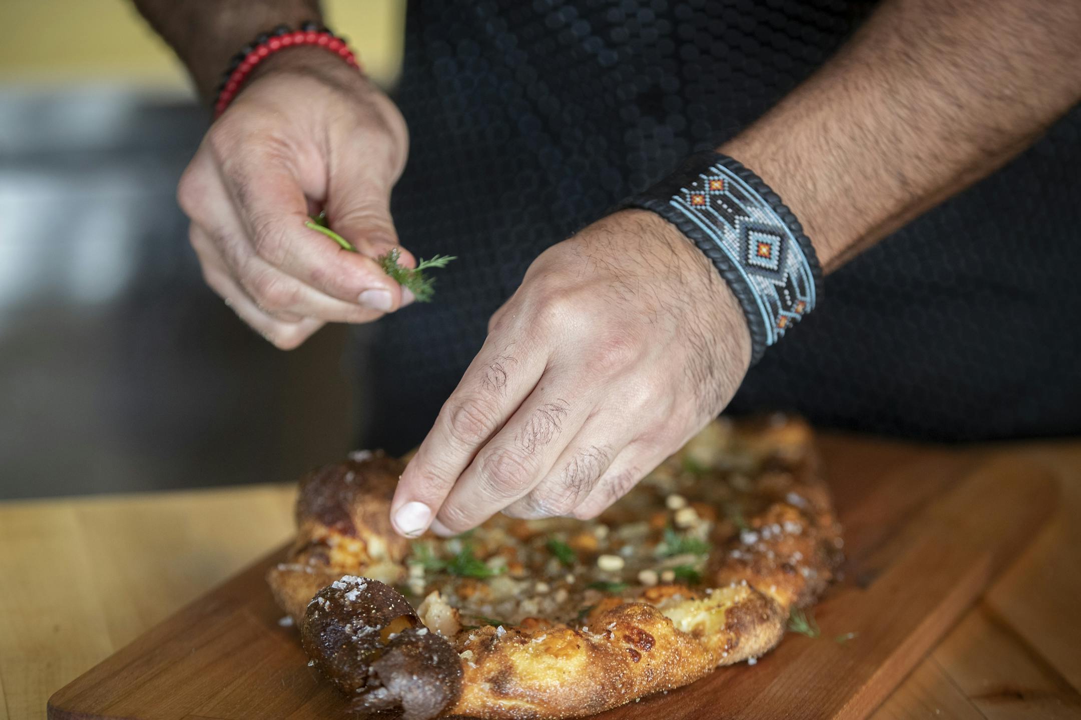 Boludo chef/owner Facundo Javier Defraia creating oe of his specialty pizzas, Thursday, March 7, 2019 in Minneapolis, MN.