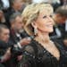 FILE - In this May 13, 2018 file photo, actress Jane Fonda poses for photographers upon arrival at the premiere of the film 'Sink or Swim' at the 71st
