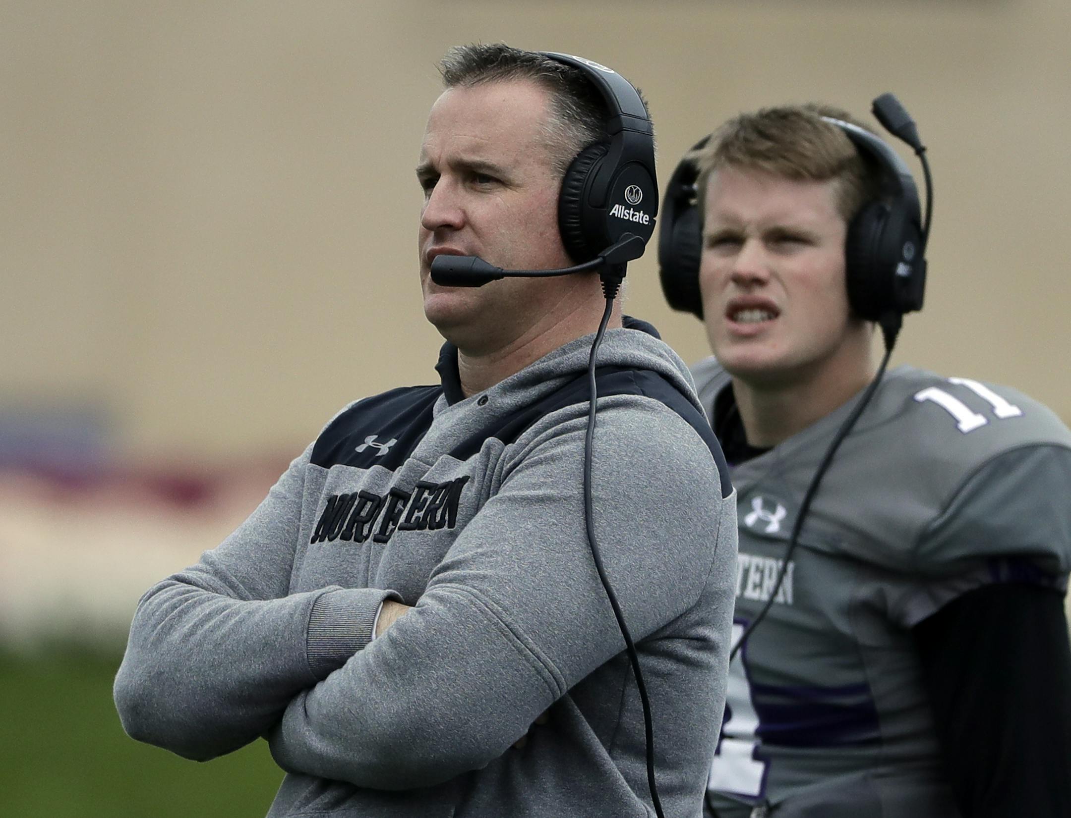 Northwestern head coach Pat Fitzgerald, left, watches his team during the second half of an NCAA college football game against Wisconsin in Evanston, Ill., Saturday, Oct. 27, 2018. (AP Photo/Nam Y. Huh)