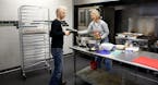 Journey Gosselin, founder of City Food Studio, handed Patti Heimbold of Patti&#x2019;s Granola oven mitts while she was using the commercial kitchen.