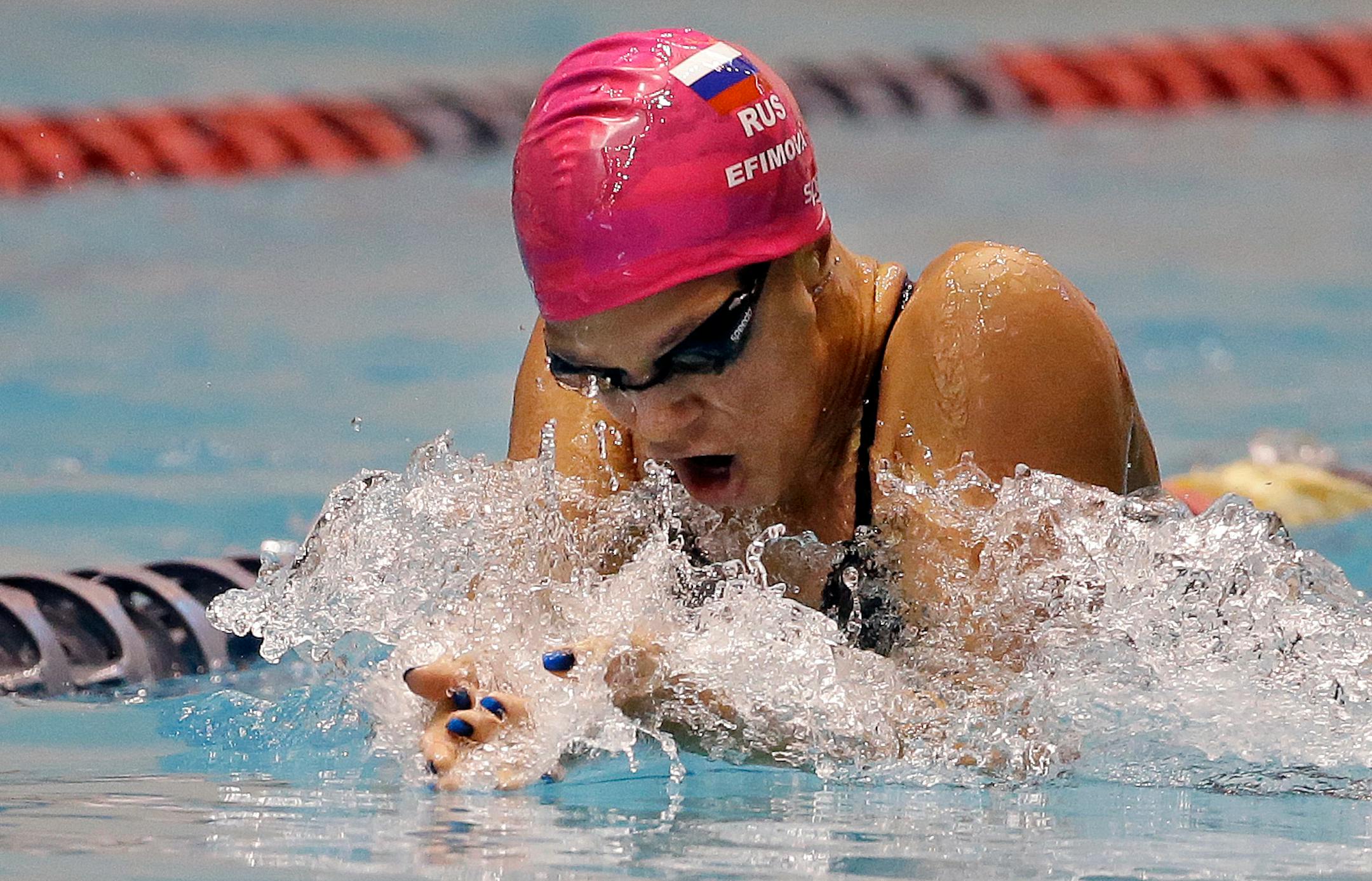 Reigning world 100-meter breaststroke champion Yulia Efimova is among four Russian swimmers withdrawn by the Russian swimming federation because they previously served doping bans, FINA said.