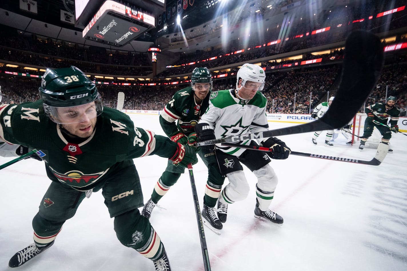 Minnesota Wild right wing Ryan Hartman (38), center Joel Eriksson Ek (14) and Dallas Stars defenseman Ryan Suter (20) vie for control of the puck during the third period of an NHL hockey game Thursday, Dec. 29, 2022 at the Xcel Energy Center in St. Paul, Minn... ] AARON LAVINSKY • aaron.lavinsky@startribune.com