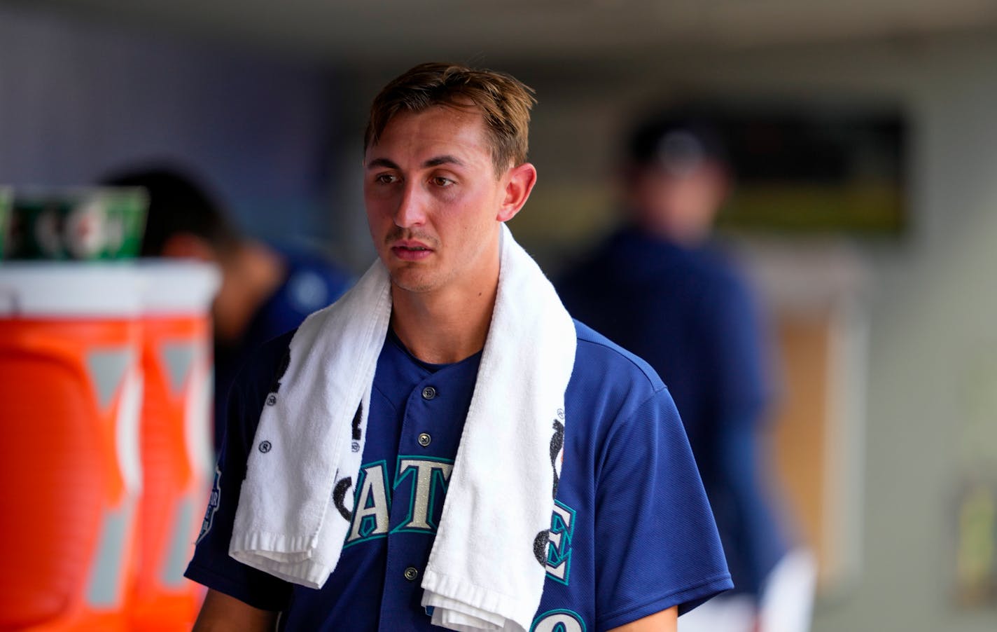 Seattle Mariners starting pitcher George Kirby walks in the dugout after pitching through seven innings of a baseball game against the Minnesota Twins, Thursday, July 20, 2023, in Seattle. (AP Photo/Lindsey Wasson)